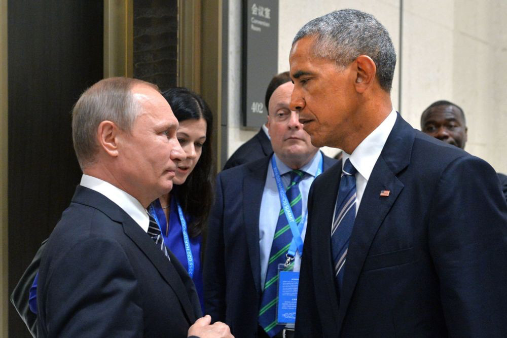 Putin looking afraid of Obama as they shake hands.