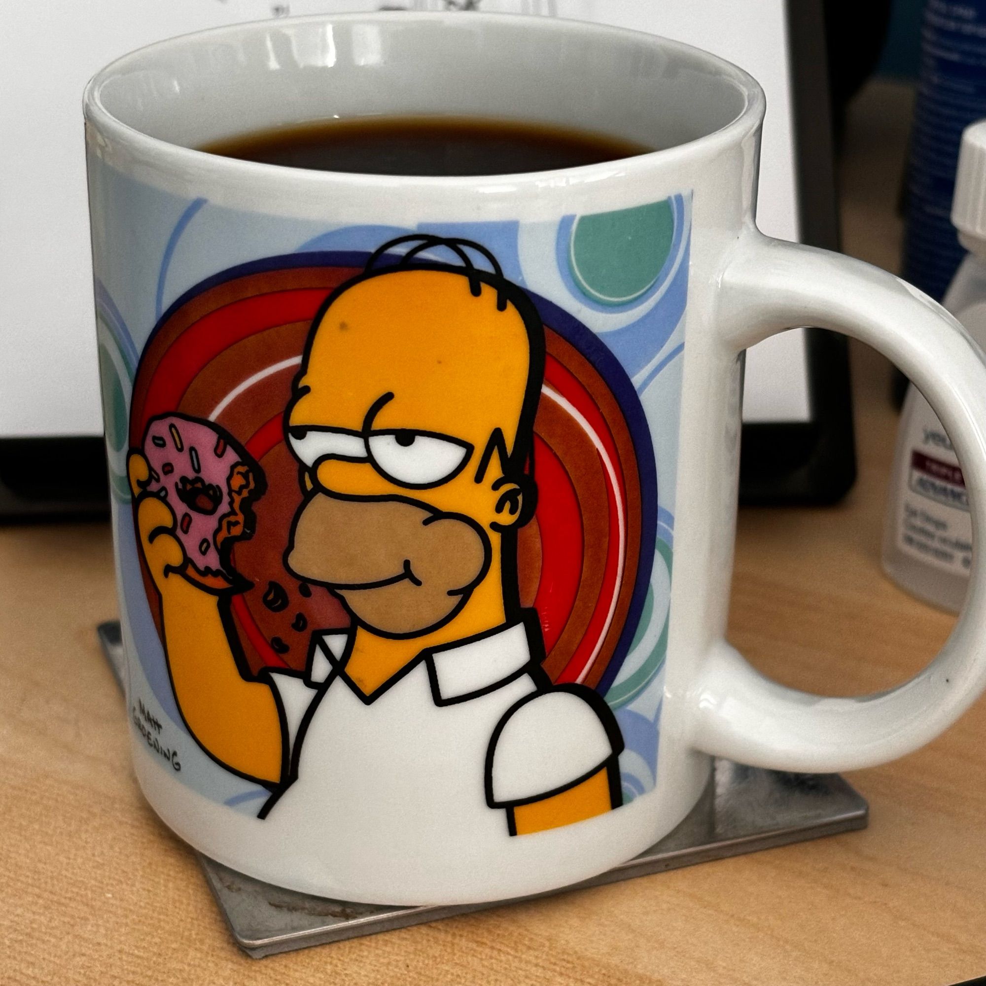 Colour photo of Homer Simpson coffee mug filled with black coffee