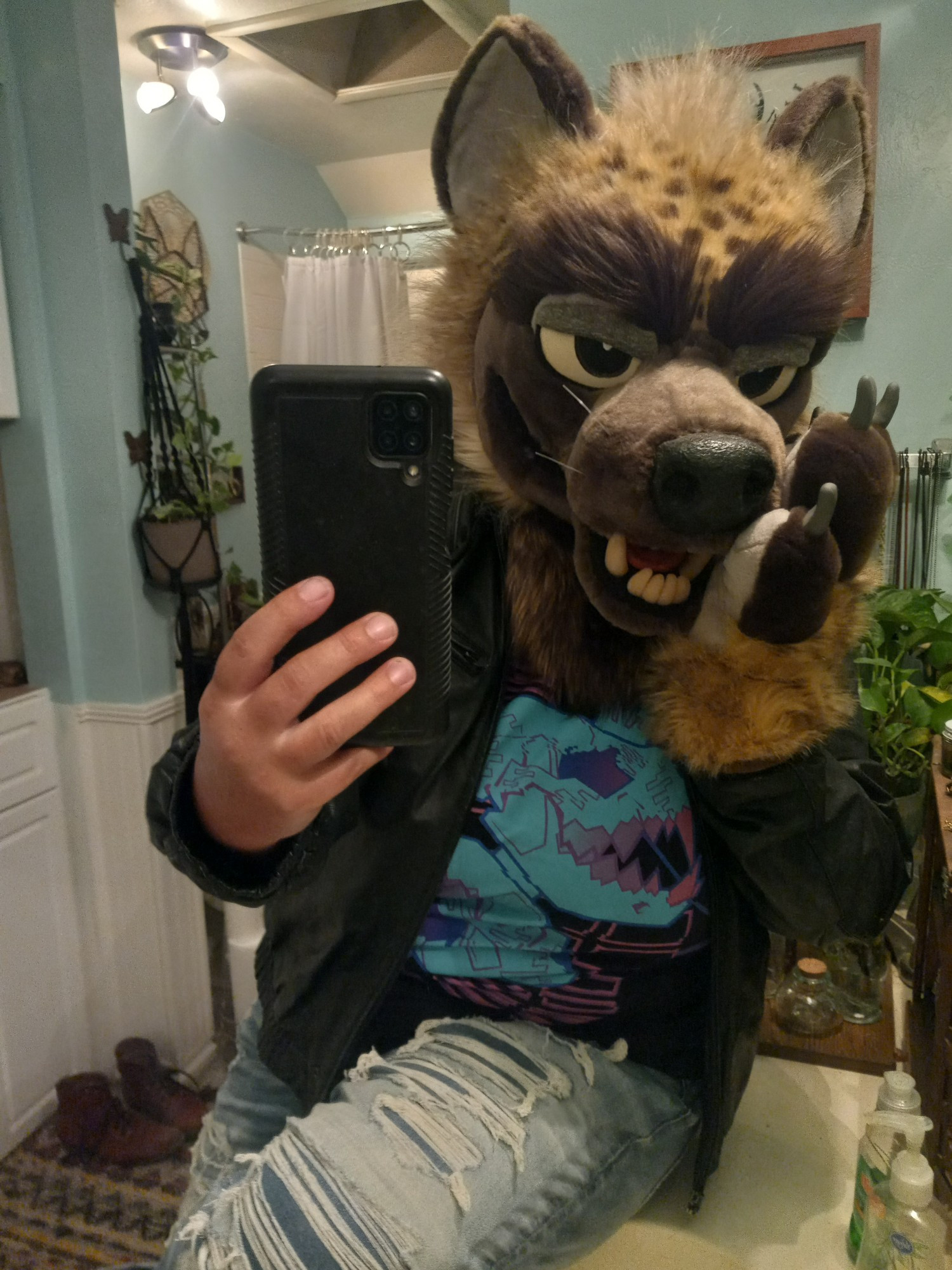 hyena fursuiter takes a selfie