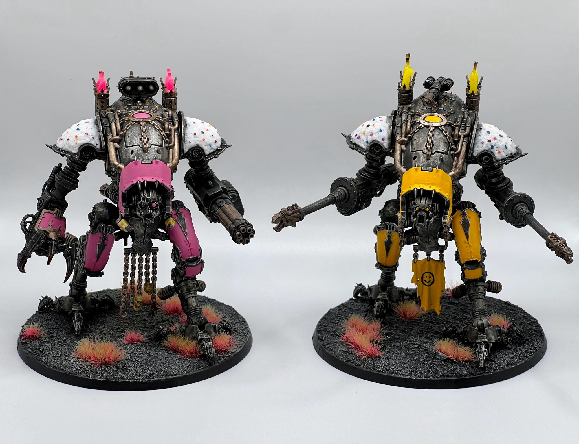 A pink war dog Karnivore and a yellow war dog executioner.