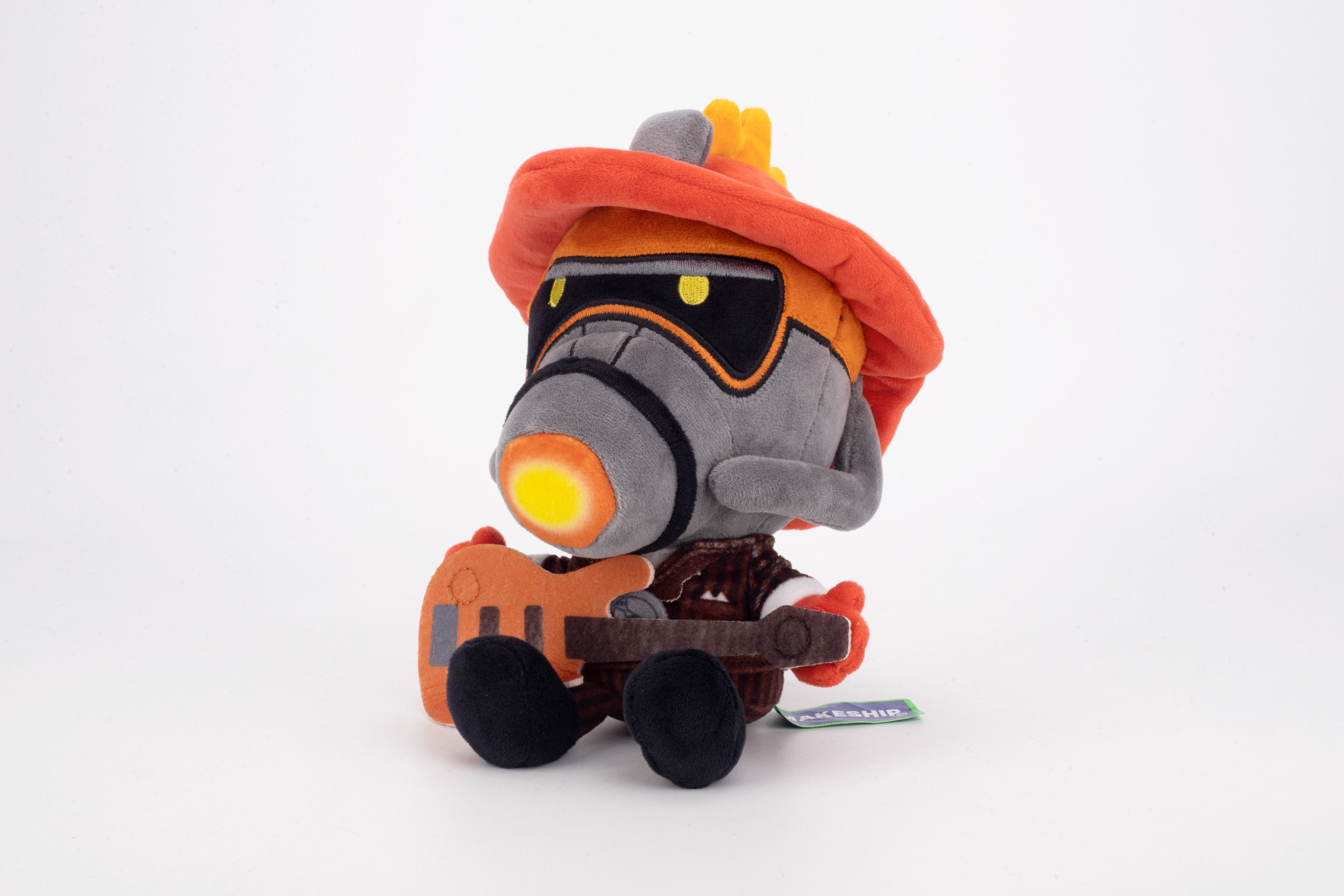 The Firestarter plushie from Makeship. In his hand is a detachable guitar made of felt.