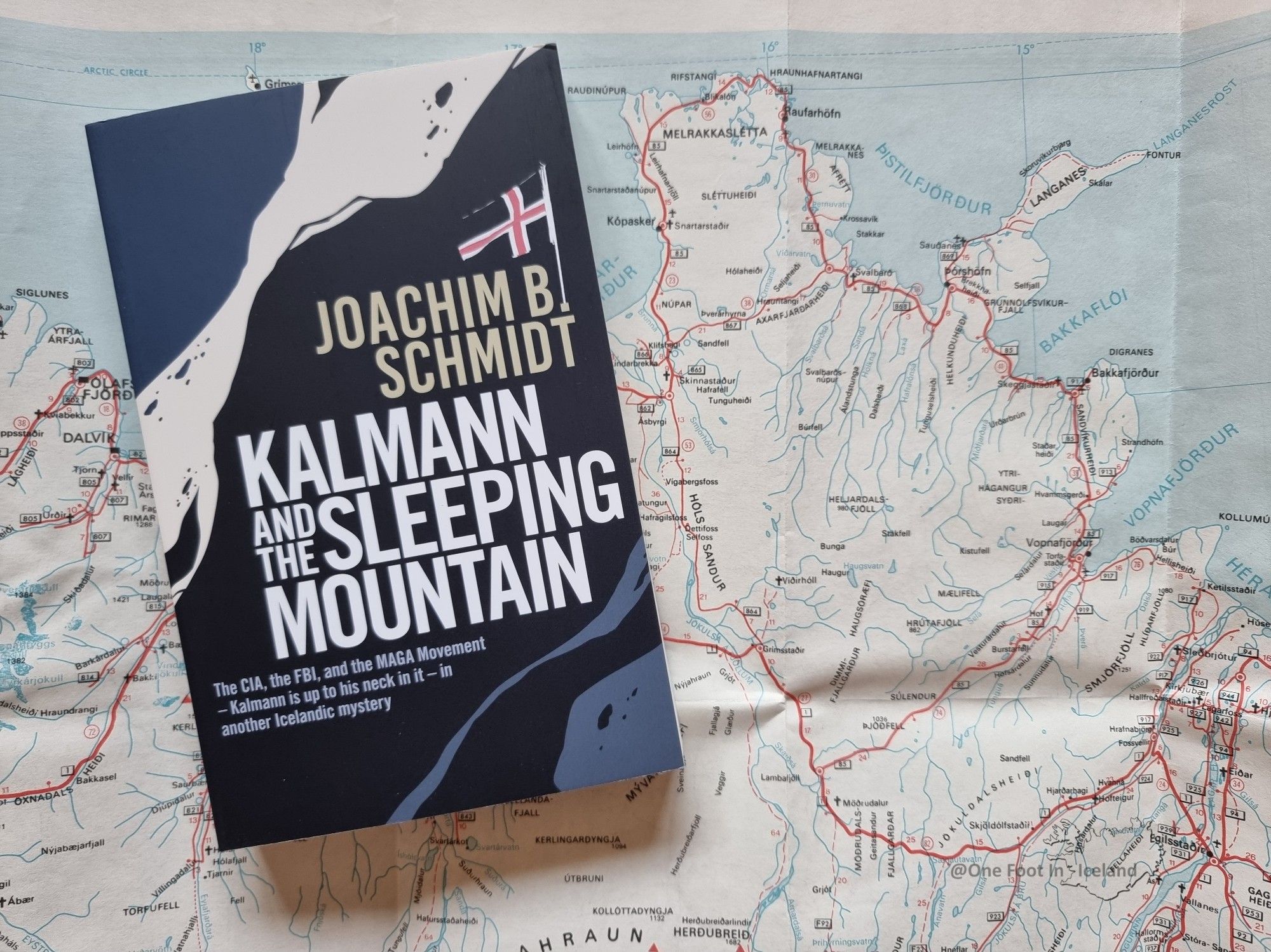 Joachim B Schmidt's book 'Kalmann & The Sleeping Mountain' lying on a road map of Iceland, alongside the Raufarhöfn peninsula where the novel is set