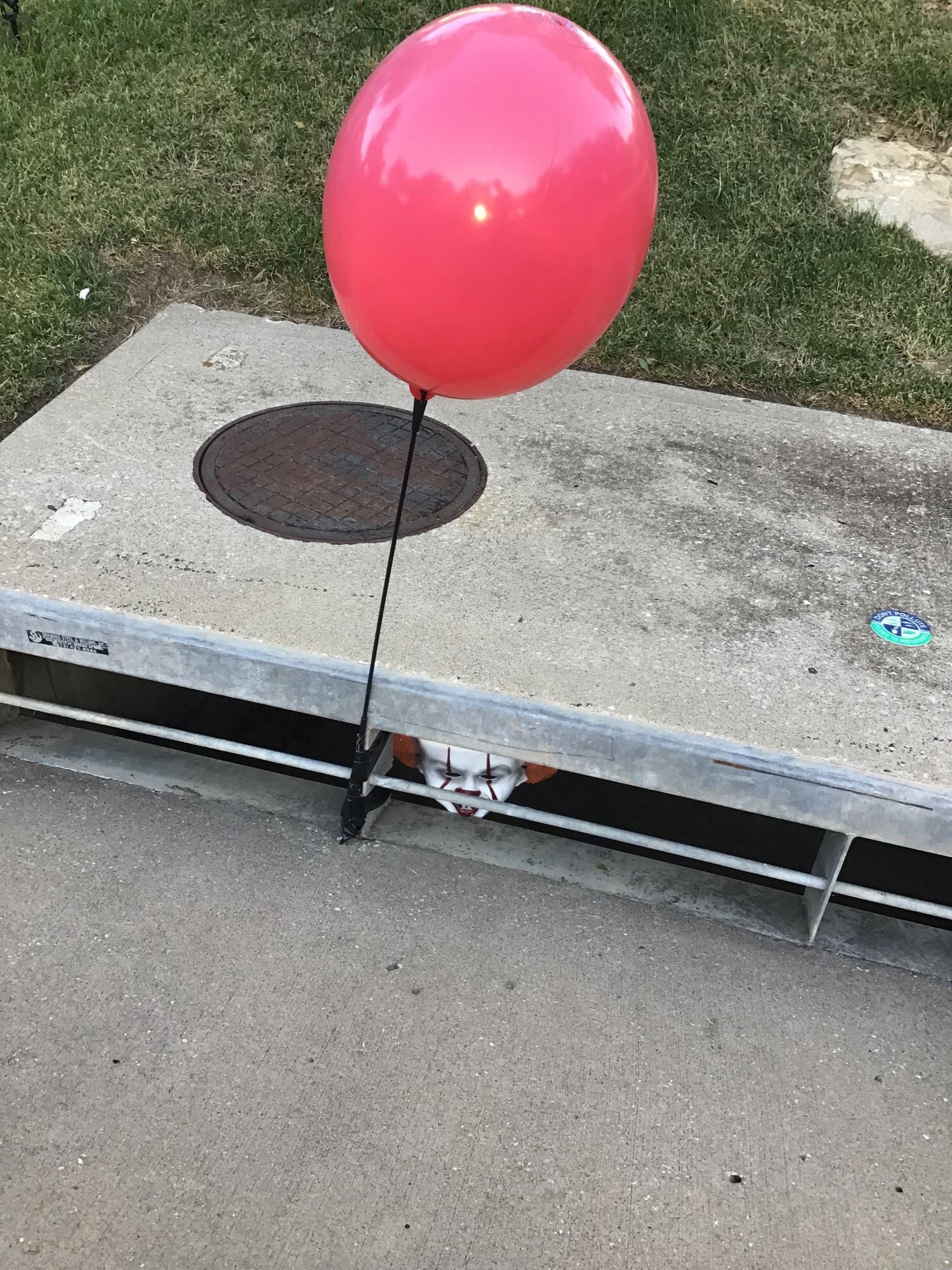 Halloween decoration. Pennywise in the sewer.