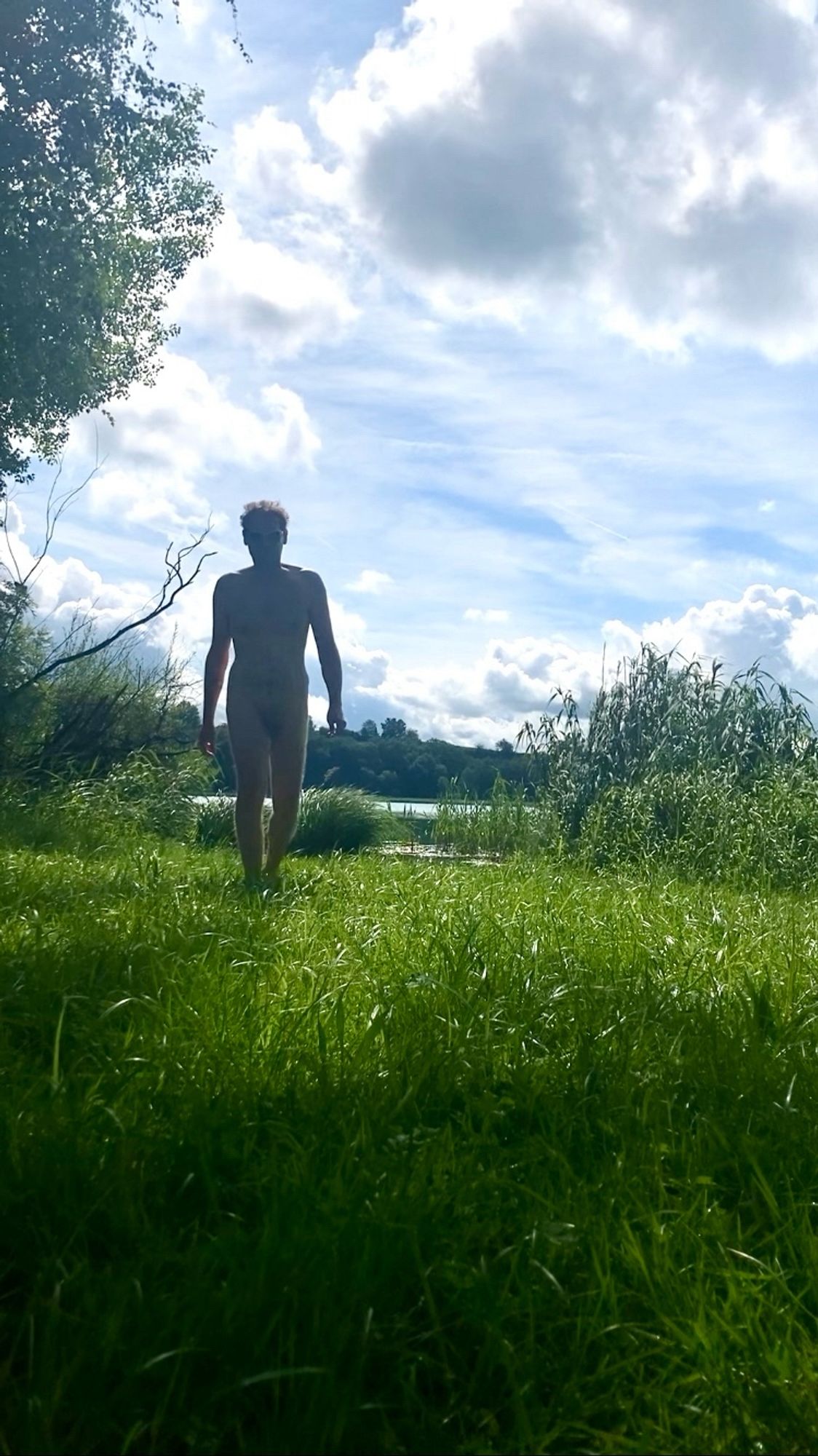 Nude man (frontal) at a lake.