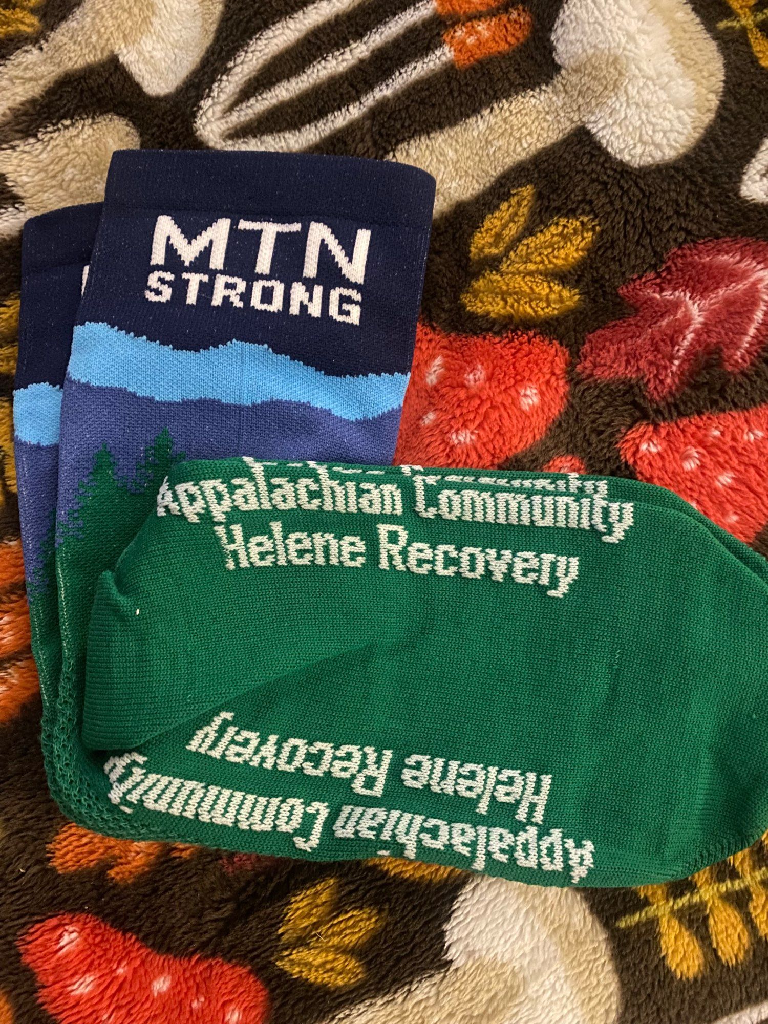 Bike socks that say MTN strong and Appalachian Community Helene Recovery