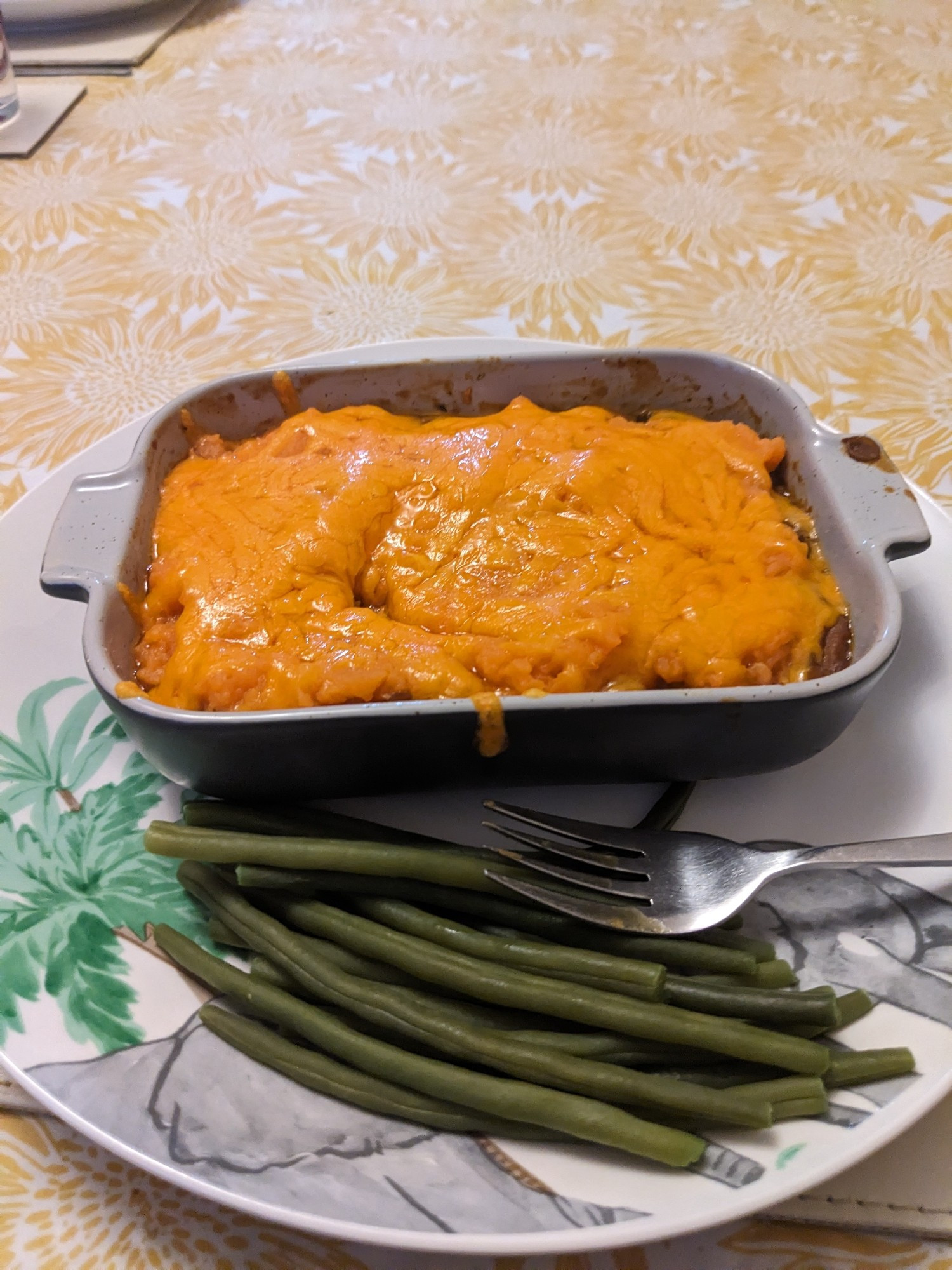 Homemade lentil based cottage pie served with green beans.