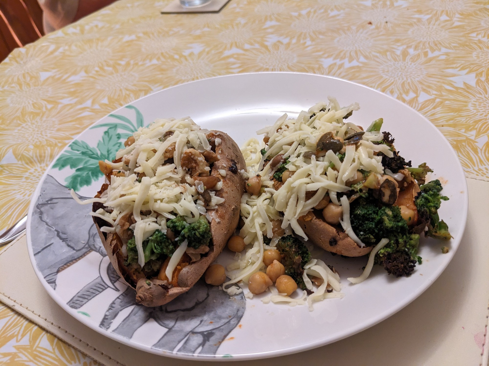 Stuffed Sweet Potatoes with chickpeas, broccoli, walnuts, pumpkin seeds and covered in mozzarella.