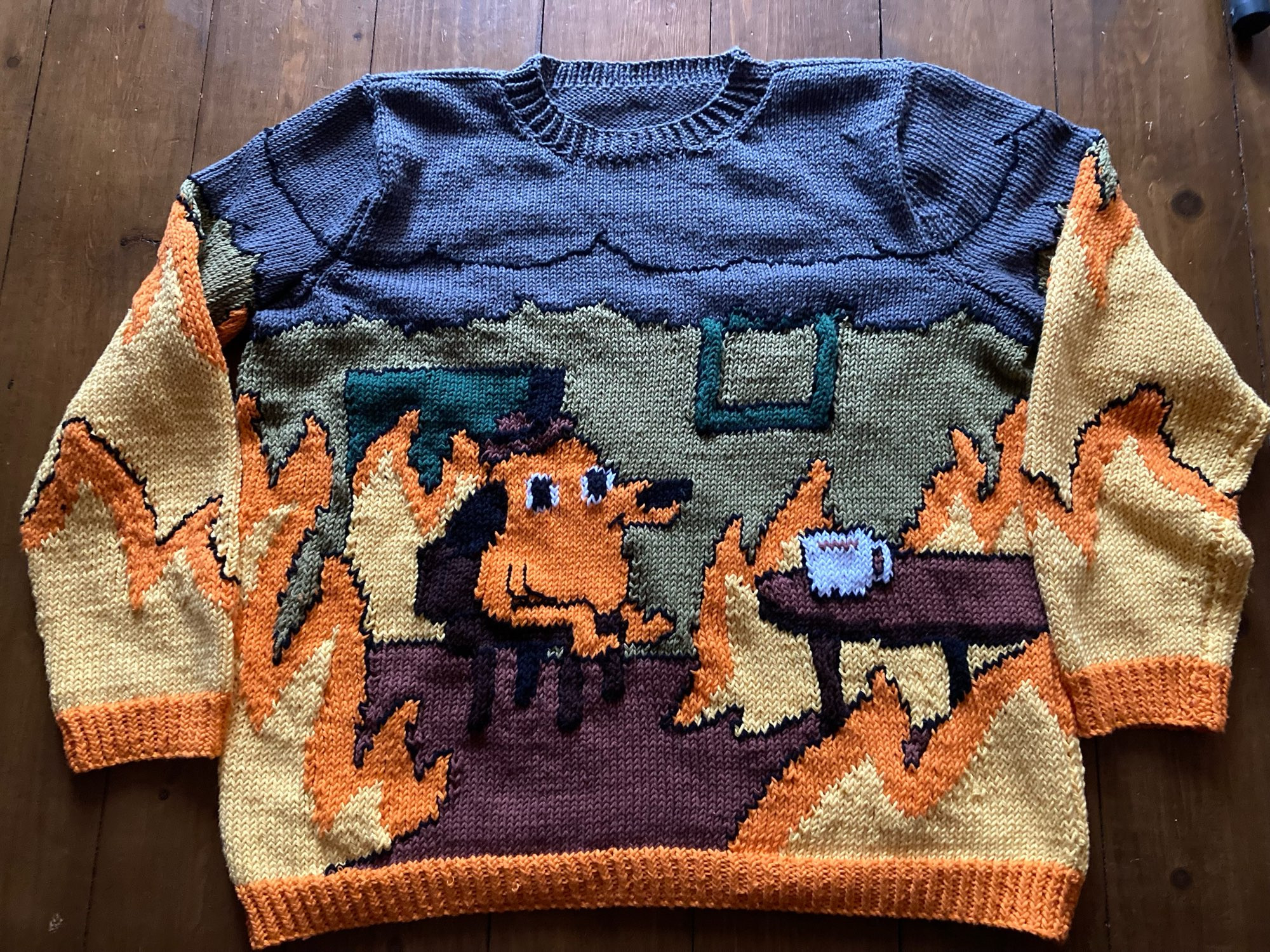 Hand knitted “fine” sweater, based on the cartoon (dog surrounded by fire)