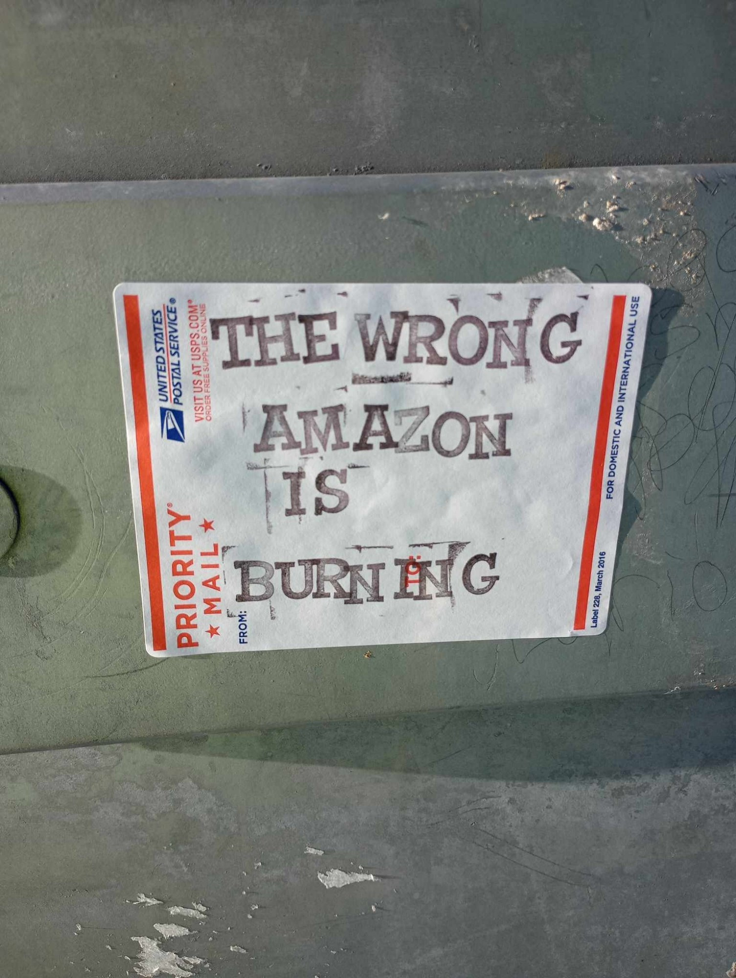 Priority main sticker that says "The wrong Amazon is burning"