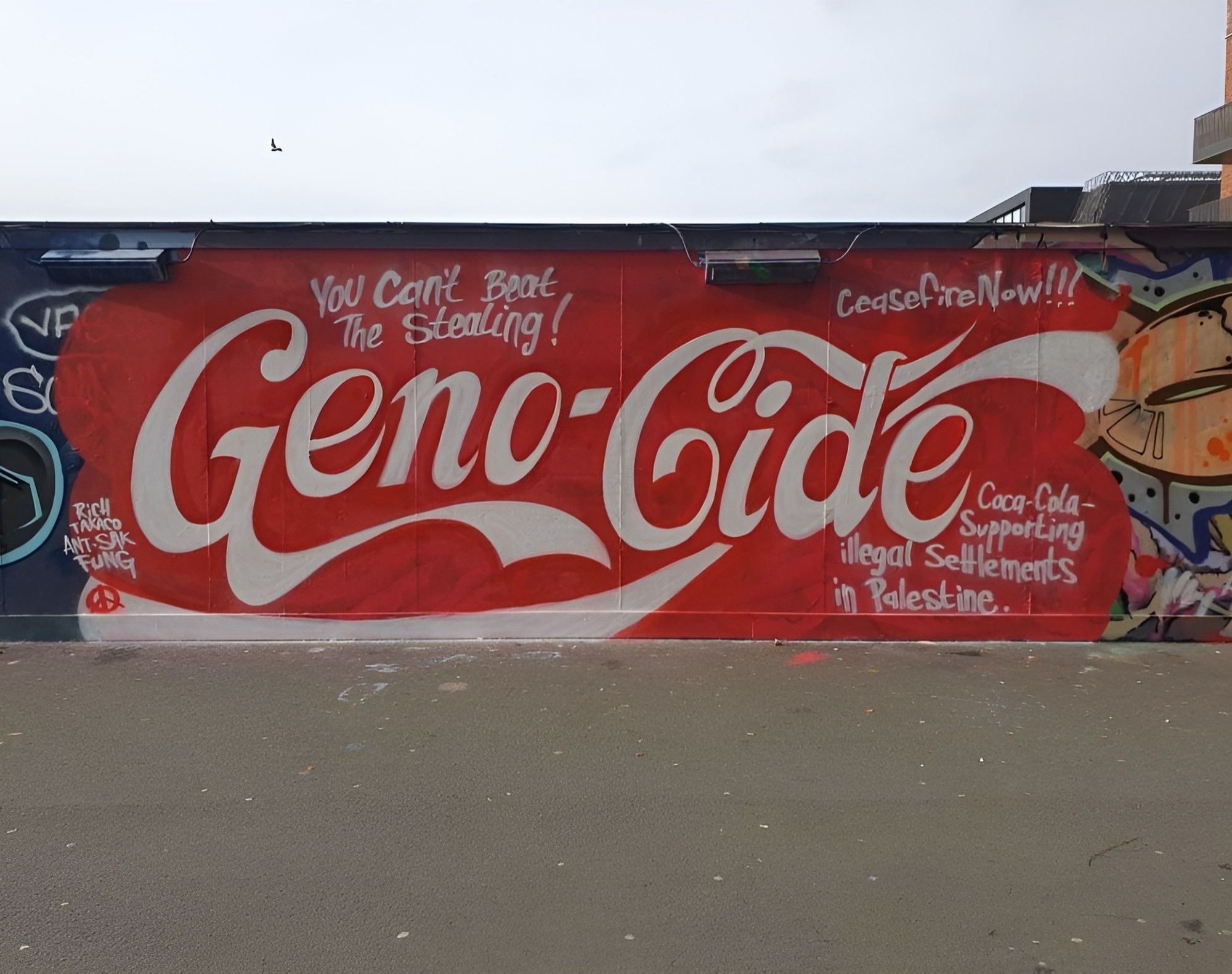 Coca Cola themed Geno-cide mural on a wall