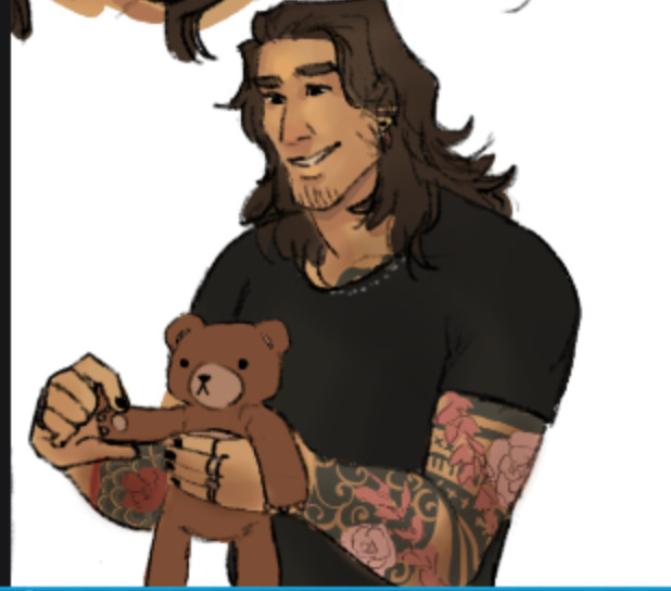 A boy with many floral tattoos on his arms, waving hello with a teddy bear. The boy has brown wolf-cut hair and a grin on his face.