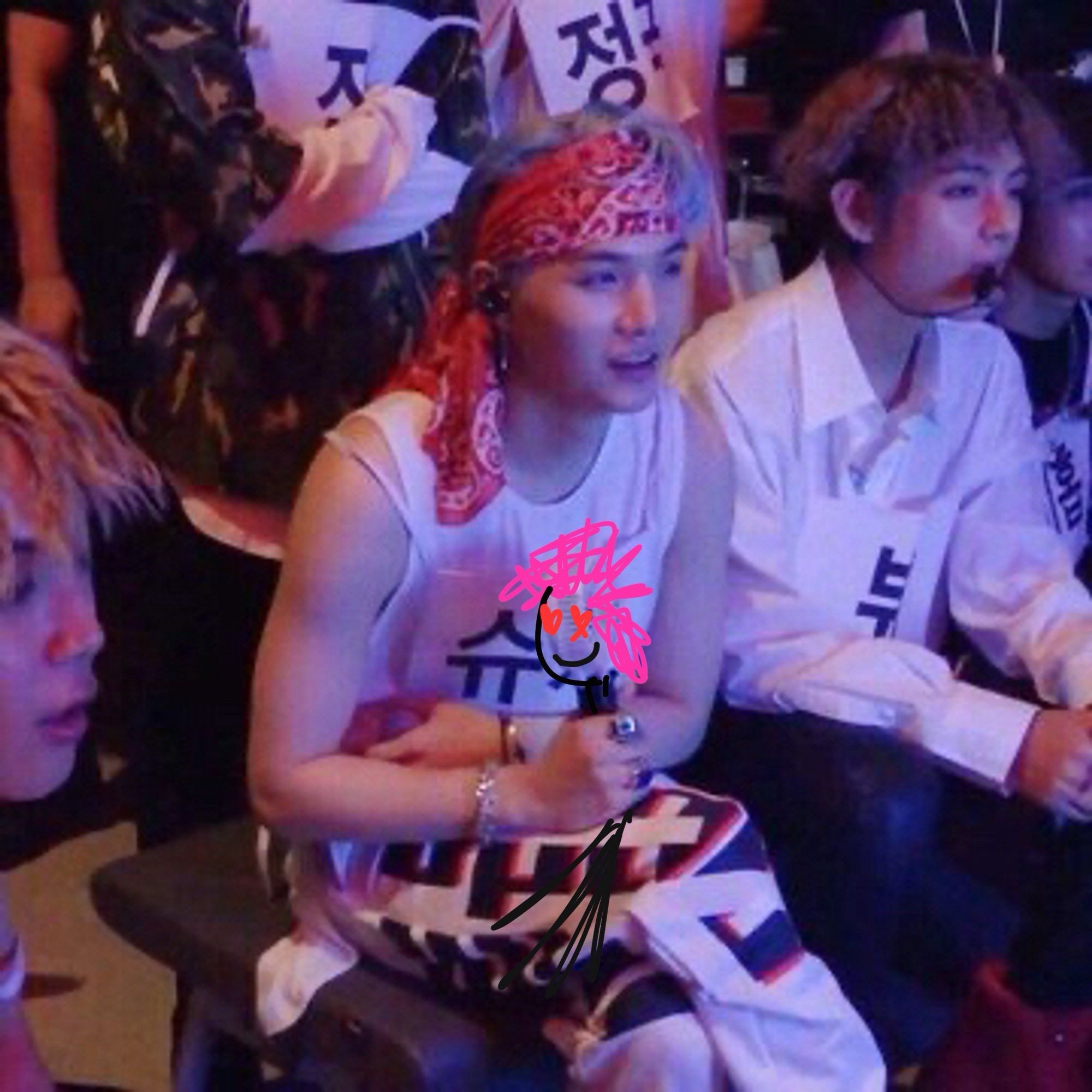 Yoongi wearing a red bandanna on his head. He’s holding a fan but someone (me) draw a stick figure with heart eyes and pink hair over it 😌