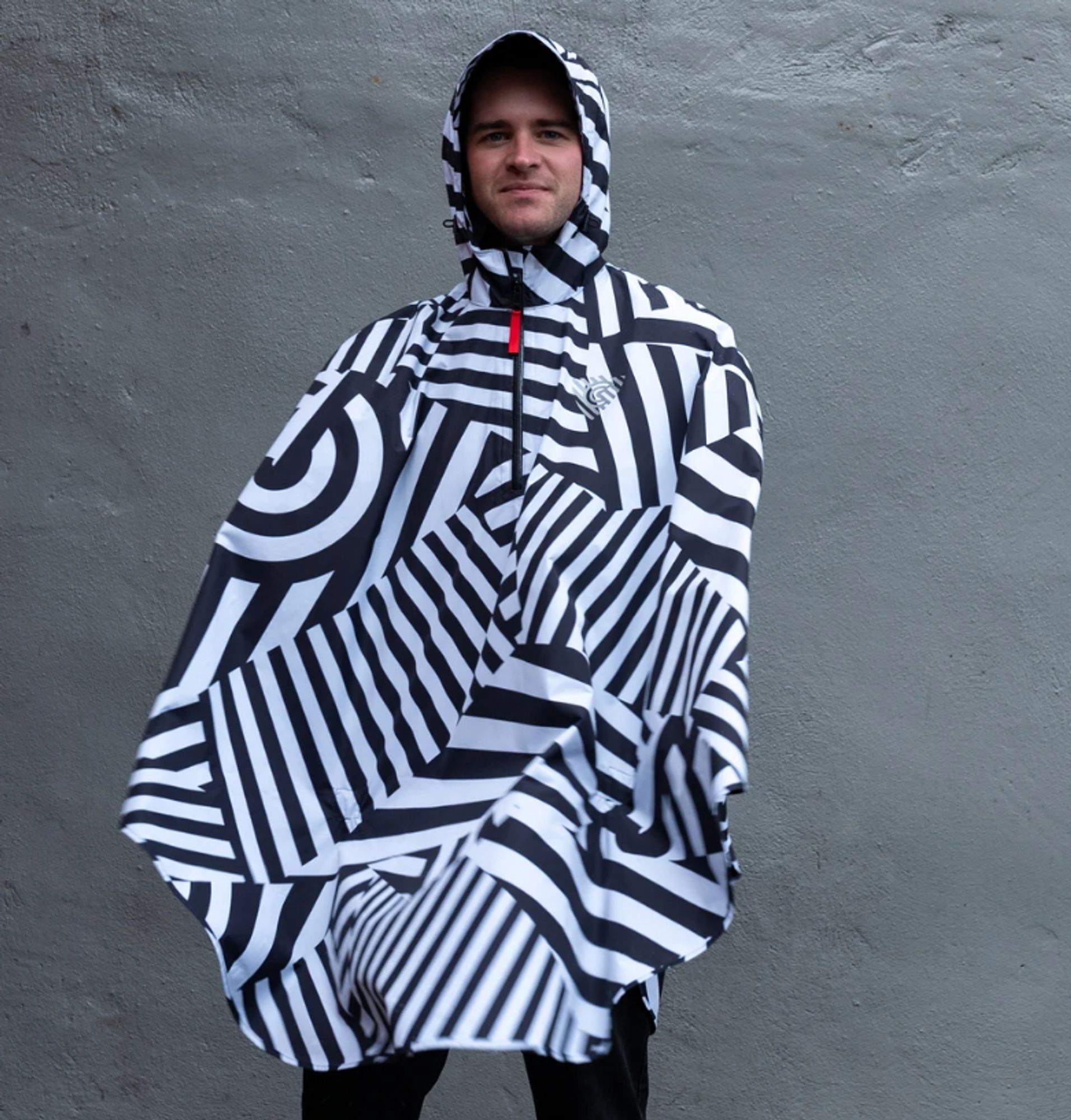 A cycling rain cape with eye popping black and white stripes