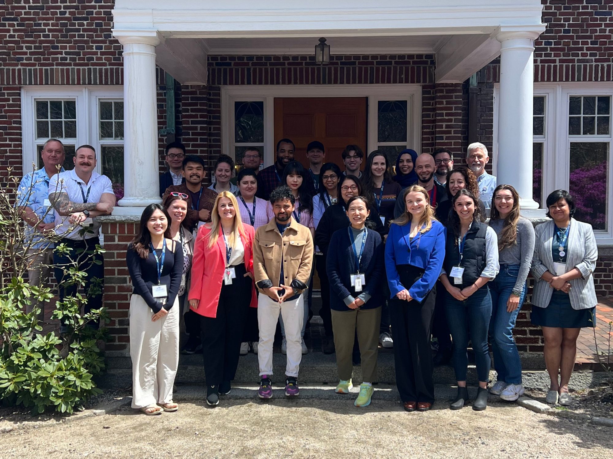 Principles and Techniques for Improving Preclinical Translation in Alzheimers Disease Research workshop participants stand together in front of The Jackson Laboratory's High Seas building on the JAX campus in Maine.