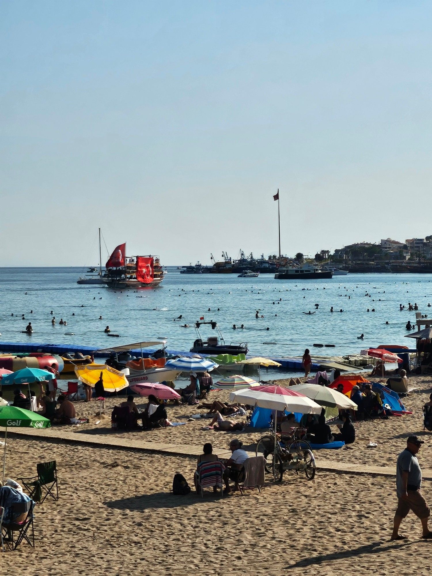 A large party boat covered in massive Turkish flags cruising along the busy main beach at Didm, a very local tourist spot. The boat was cranking tunes that matched the nationalist messaging of the massive flags