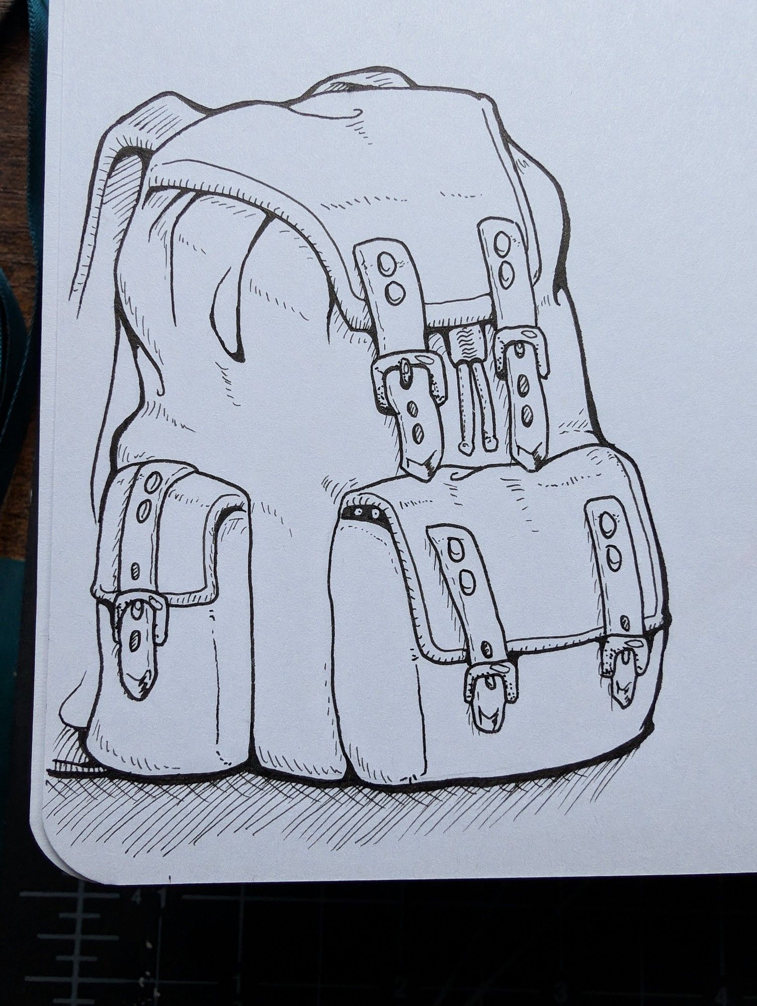 Backpack rendered in ink with little soot sprite peaking out of pocket.