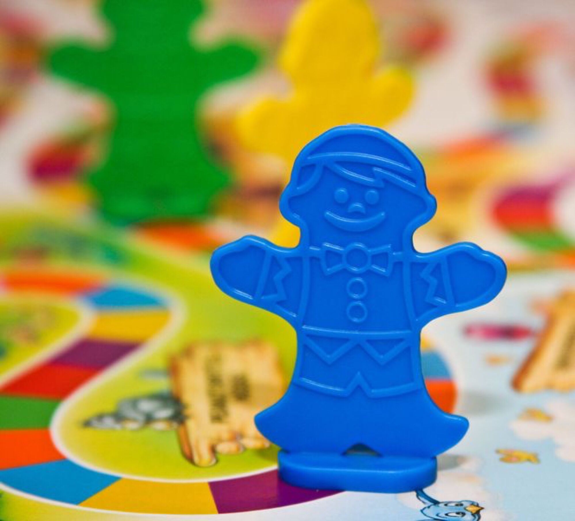 Candy Land player piece that looks like a ginger bread man, emphasis on man