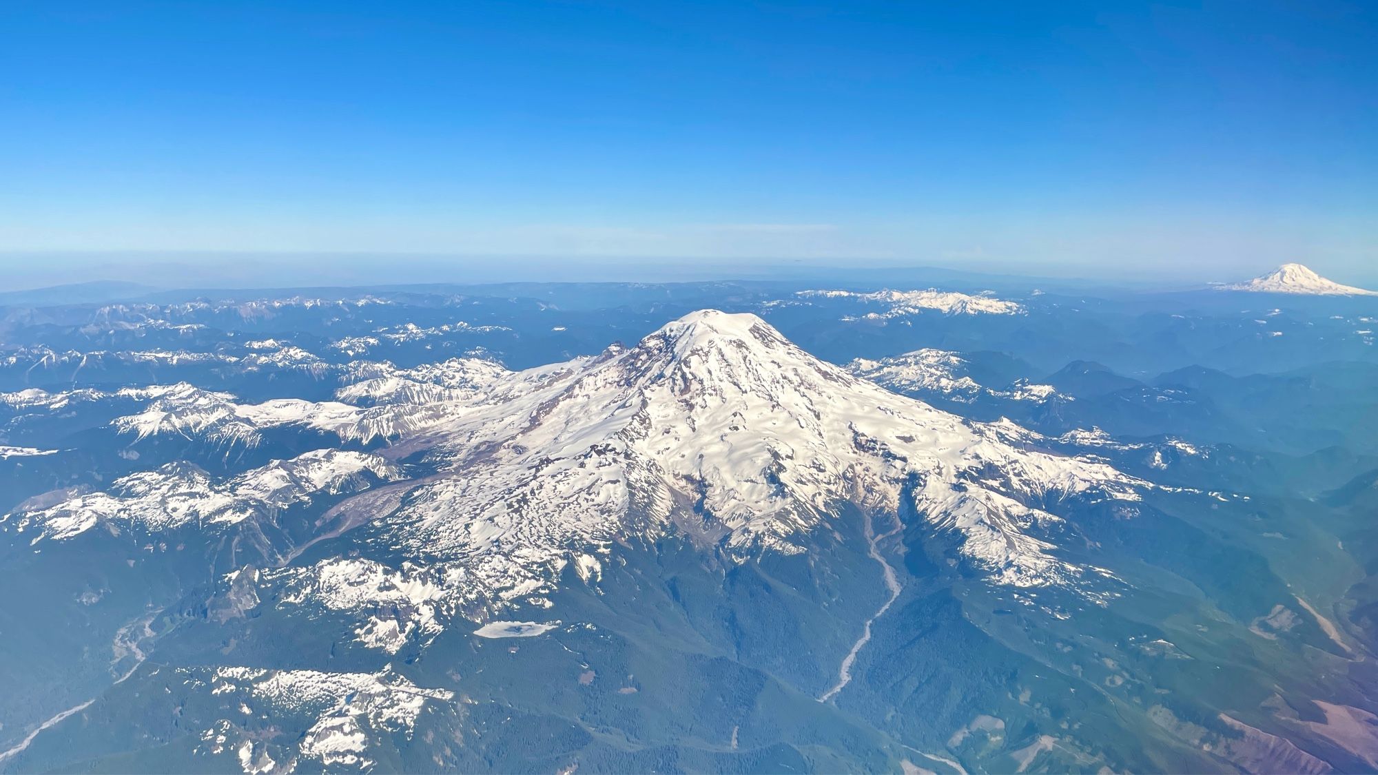 A photo of Mount Rainier taken from an airplane en route to parts unknown.