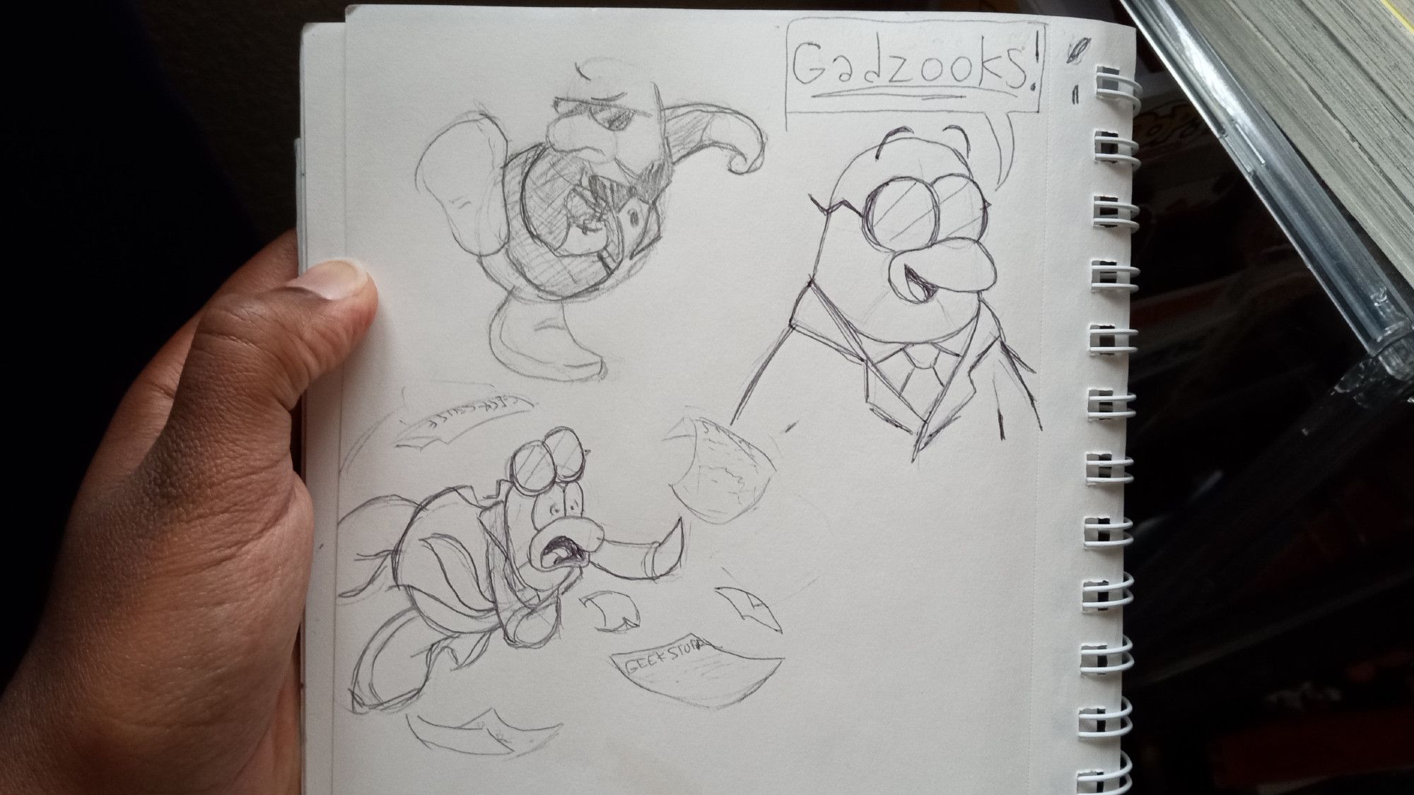 Several Club Penguin sketches: 
- Jet Pack guy winding up to run. He's missing his jetpacks because I didn't know how to draw them.
- A bust of Gary the Gadget Guy saying "Gadzooks!"
- Gary the Gadget Guy tripping and falling over while screaming. His glasses are flying off his face and he's dropping sheets of paper everywhere. The papers read: "Geek Stuff"