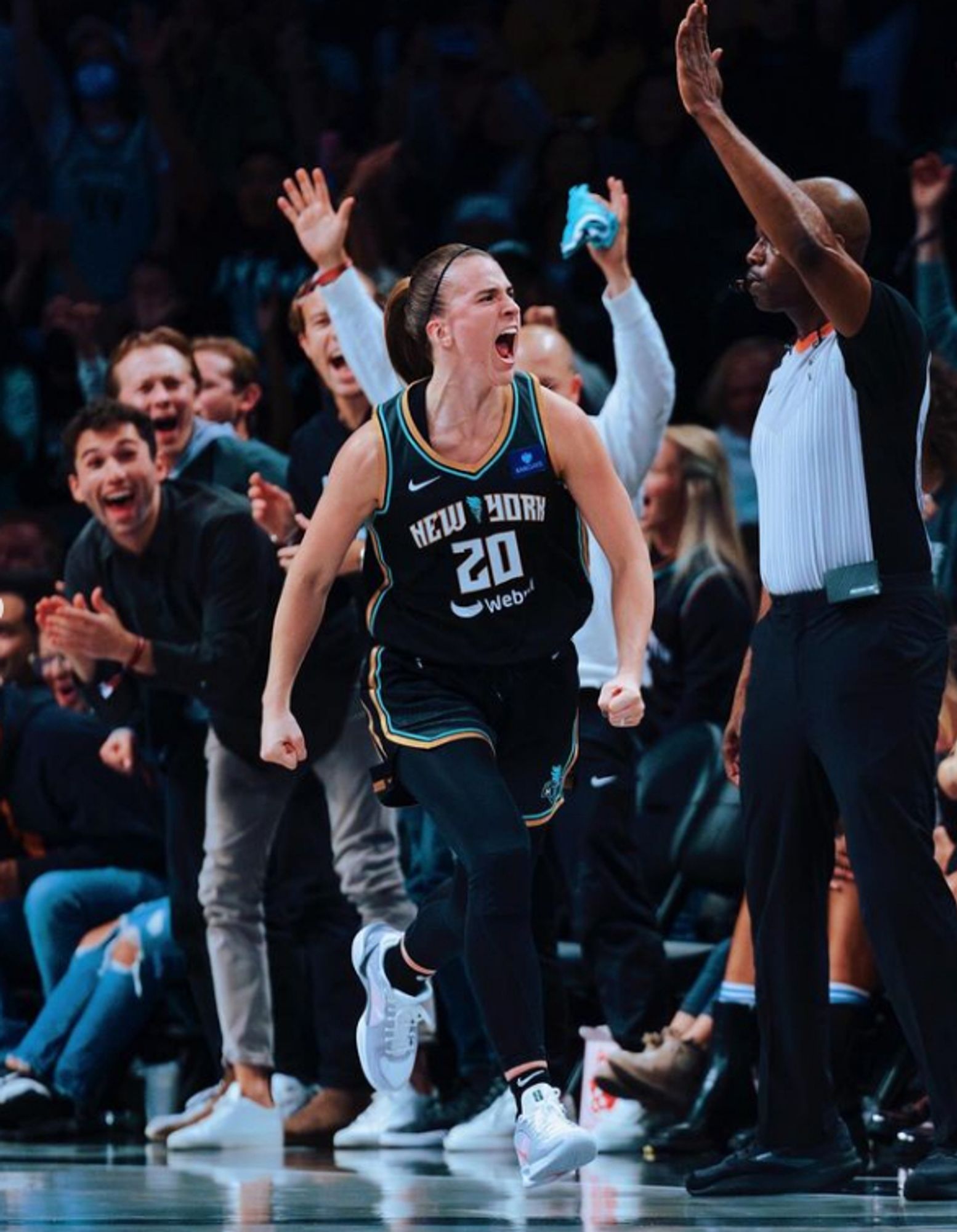 NY Liberty's Sabrina Ionescu running down the court, fired up, and looking like the unstoppable force she is.