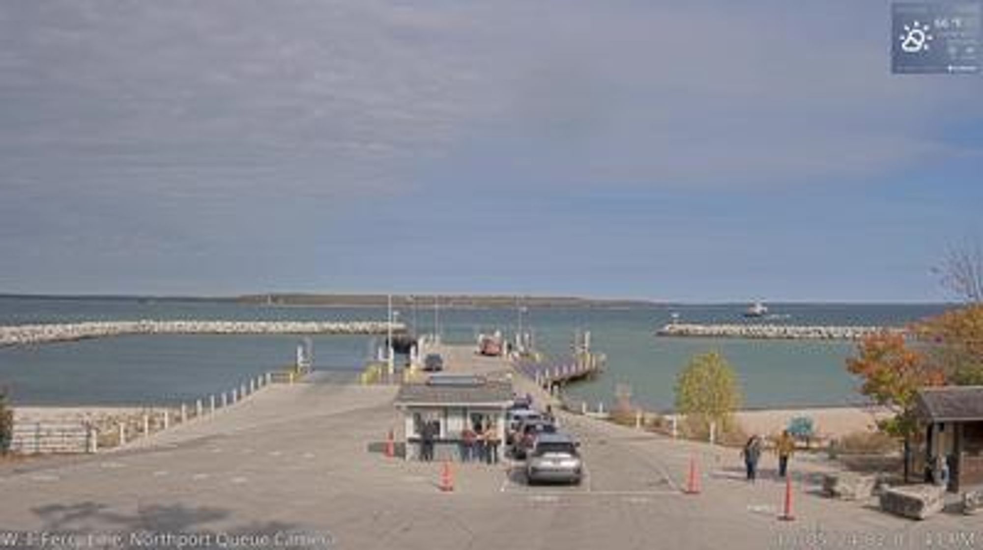 A small security building in the foreground leading into the Liberty Grove ferry docking area and Lake Michigan in the background. // Image captured at: 2024-10-05 19:05:00 UTC (about 28 min. prior to this post) // Current Temp in Liberty Grove: 64.77 F | 18.21 C // Precip: overcast clouds // Wind: SSE at 9.216 mph | 14.83 kph // Humidity: 63%