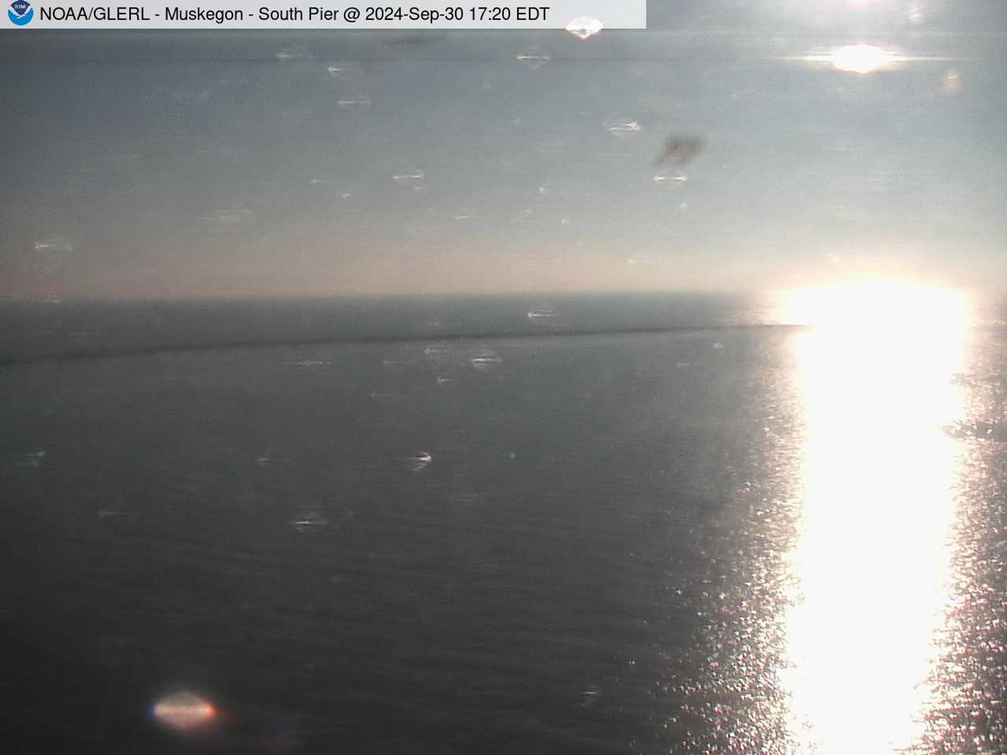 Wide view of the Muskegon channel southern breakwater stretching into Lake Michigan. // Image captured at: 2024-09-30 21:20:01 UTC (about 13 min. prior to this post) // Current Temp in Muskegon: 73.07 F | 22.82 C // Precip: few clouds // Wind: WSW at 8.053 mph | 12.9 kph // Humidity: 77%