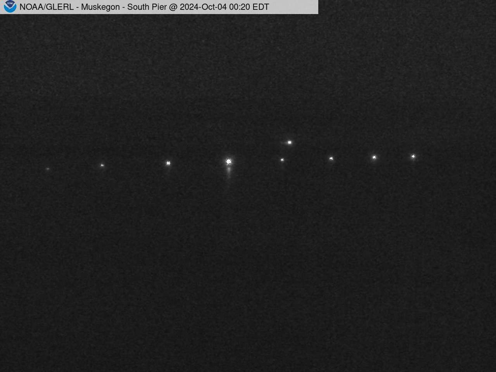 Wide view of the Muskegon channel southern breakwater stretching into Lake Michigan. // Image captured at: 2024-10-04 04:20:01 UTC (about 13 min. prior to this post) // Current Temp in Muskegon: 55.25 F | 12.92 C // Precip: clear sky // Wind: NNE at 6.912 mph | 11.12 kph // Humidity: 73%