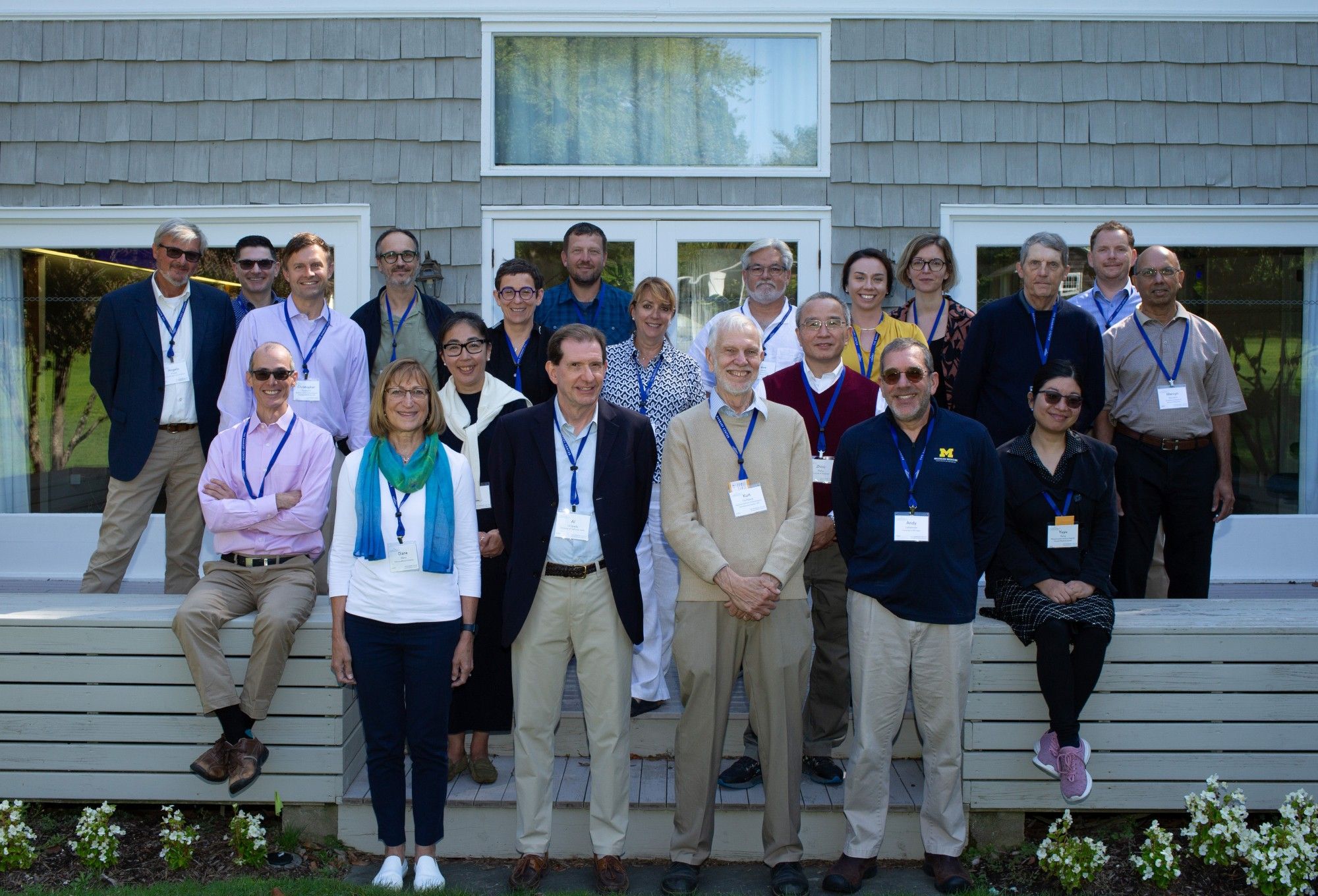 Group of 21 participants on the patio outside the conference center