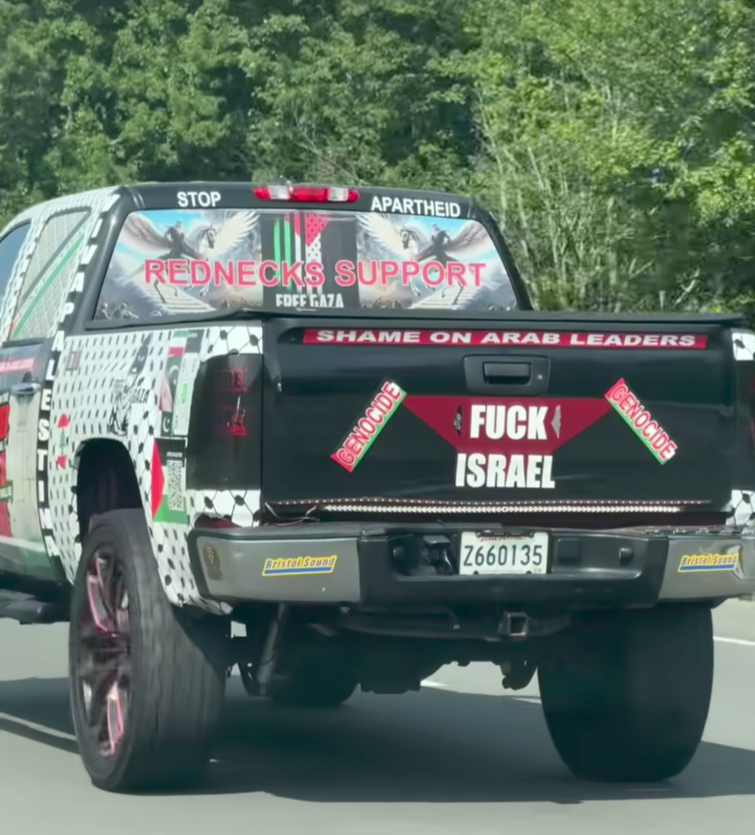 truck with "rednecks support free Gaza" on the back window. covered in fuck Israel stickers