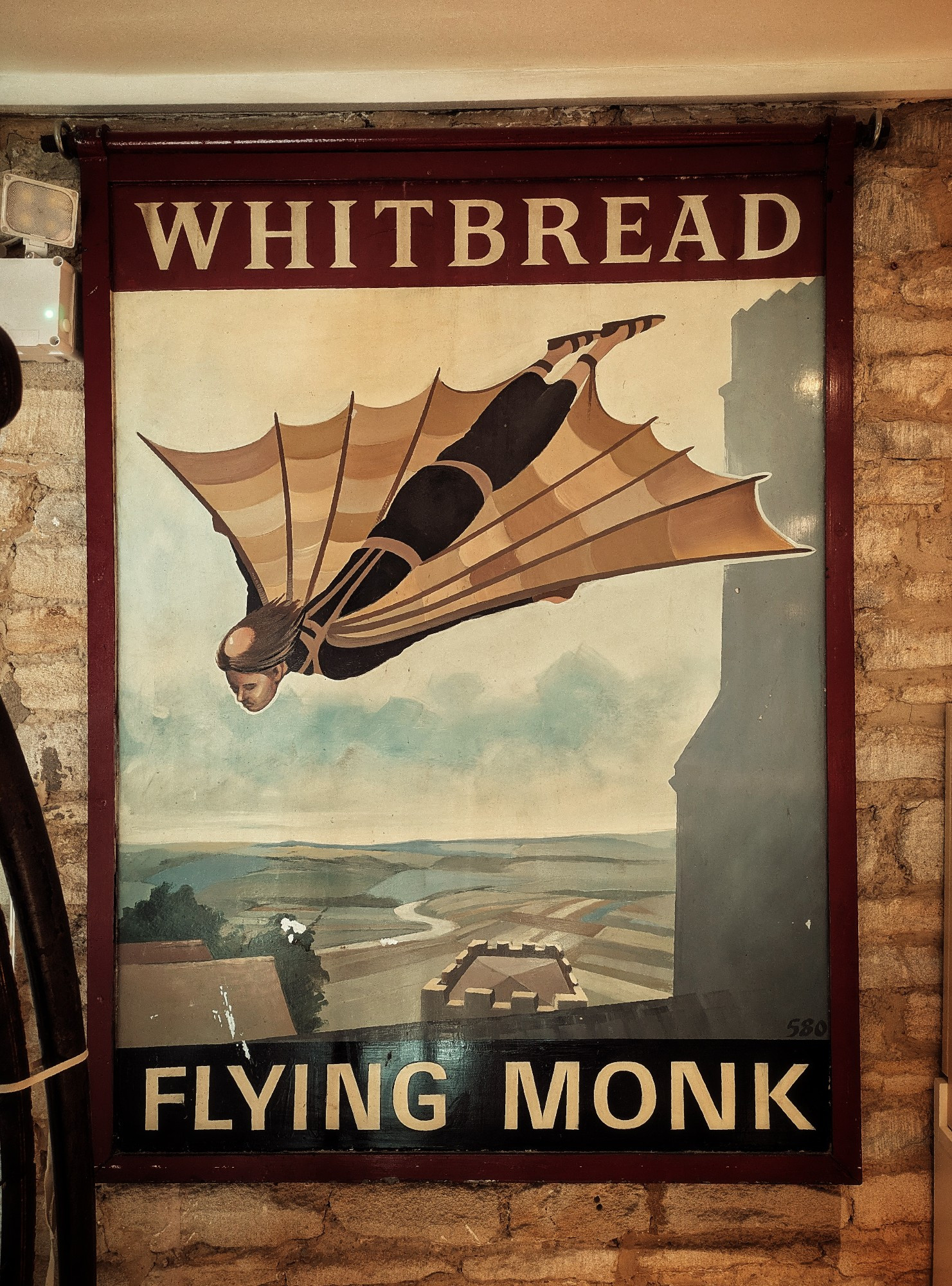 The 1950s pub sign 'Flying Monk' depicting Eilmer of Malmesbury in flight.