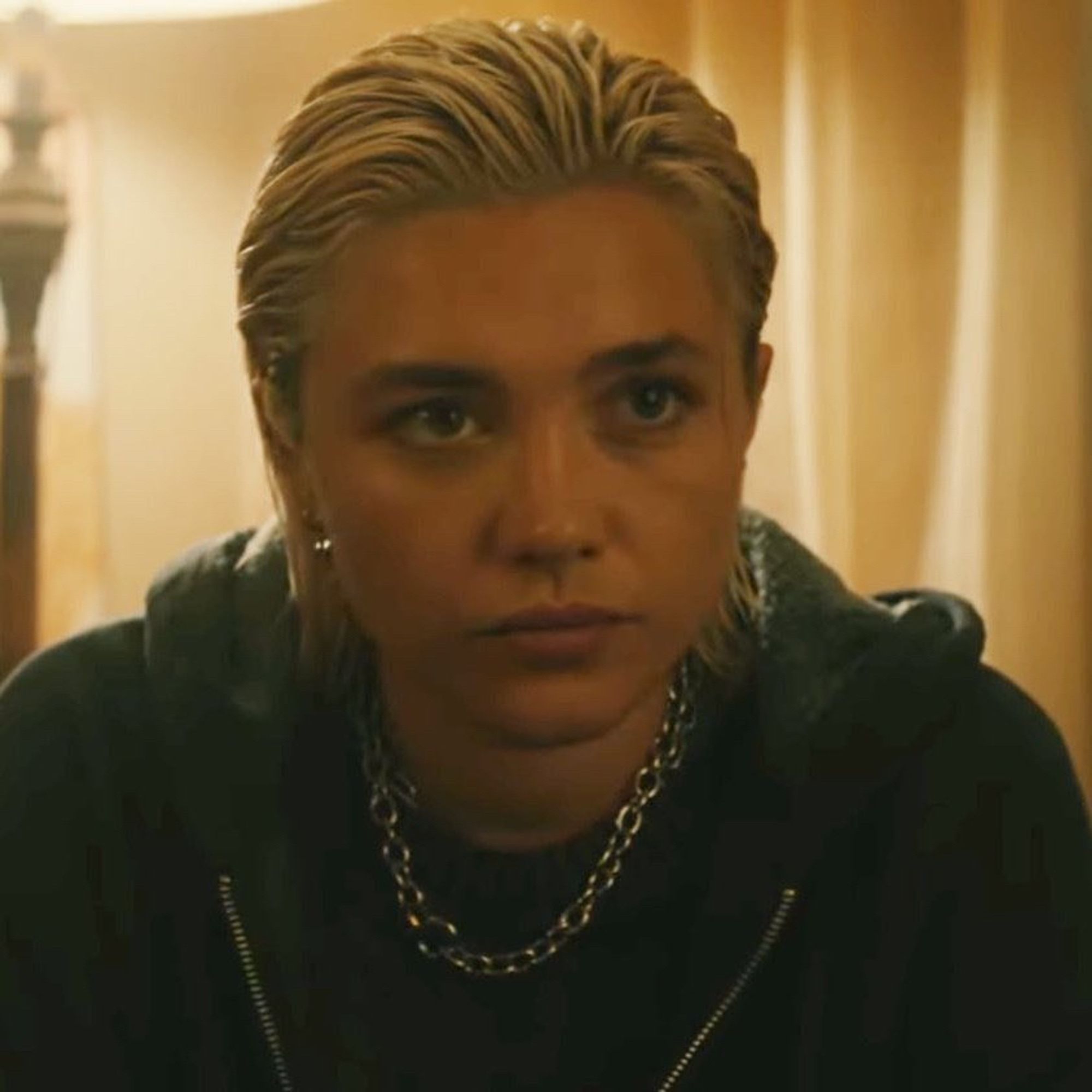 Florence Pugh as Yelena in “Thunder Bolt”. She’s wearing a chain necklace.