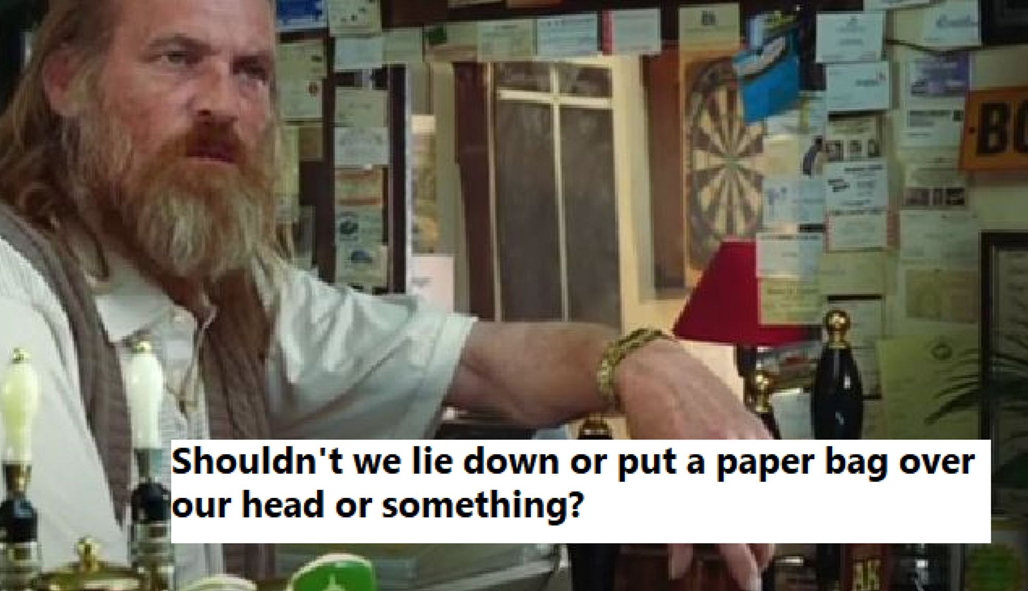 Screenshot from the 2005 film The Hitchhiker's Guide to the Galaxy: A bearded, middle-ages pub keeper is standing behind his bar with text overlay: shouldn't we lie down or put a paper bag over our head or something?