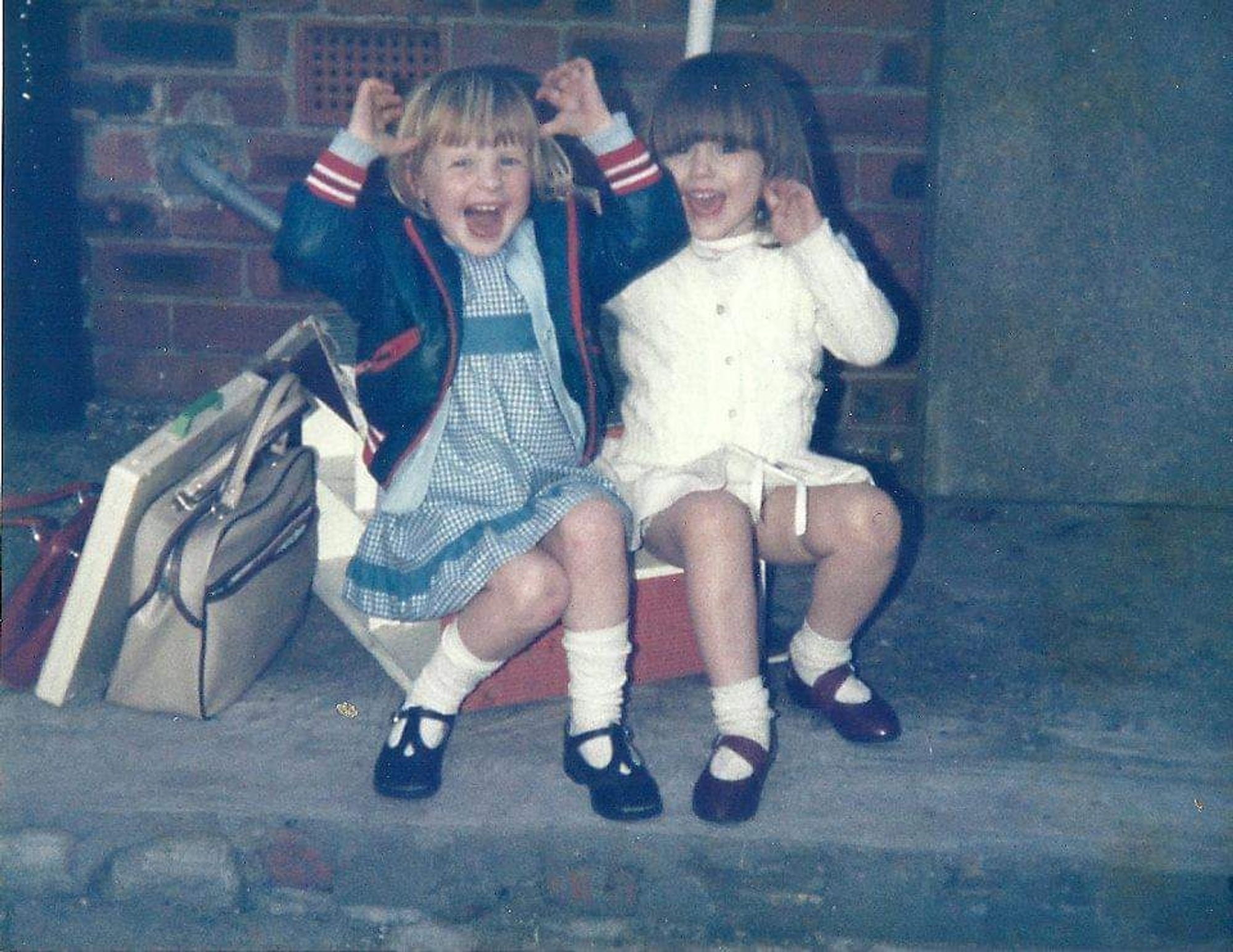 Both of us sitting on a suitcase aged about 3/4