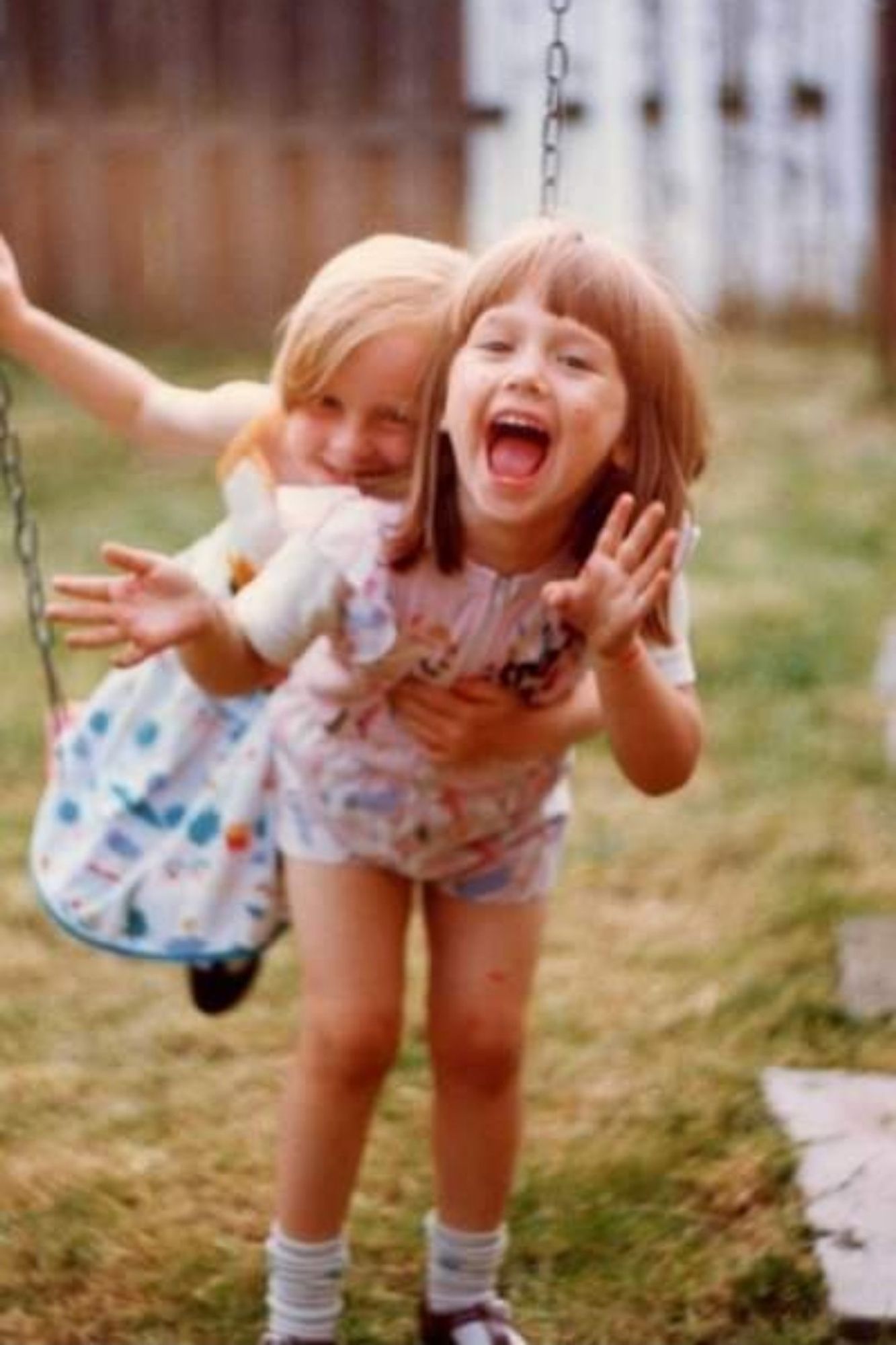 A photo of me and my friend on a swing aged about 5/6?