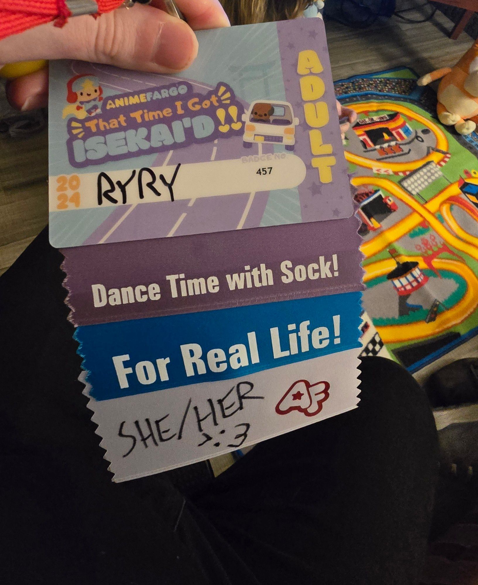 My anime Fargo badge with some silly Bluey ribbons. Dance Time with Socks and For Real Life