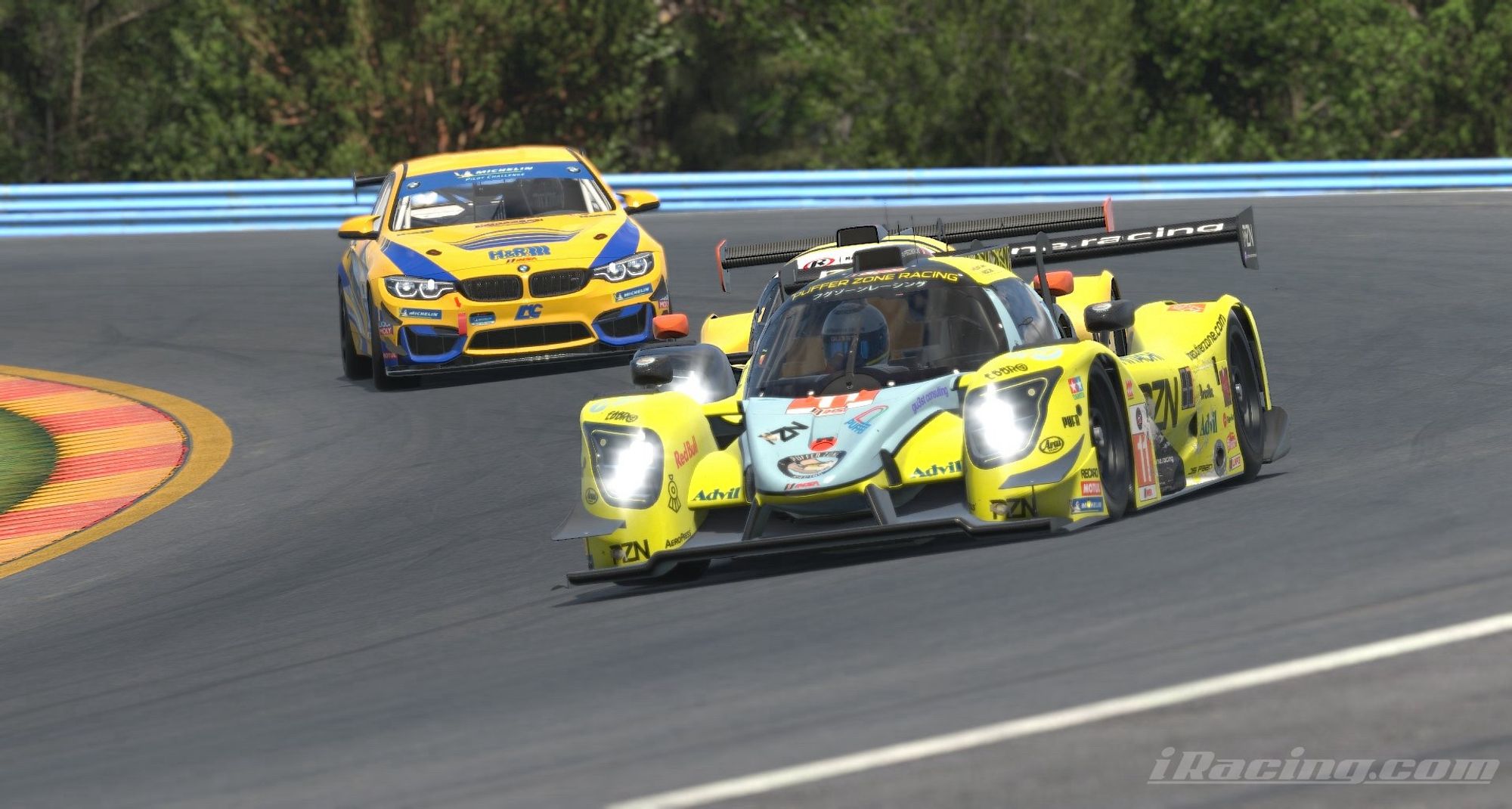 Puffer Zone Racing Ligier LMP3 car going through the carousel at Watkins Glen, followed by another LMP3 car and a BMW M4 GT4 car