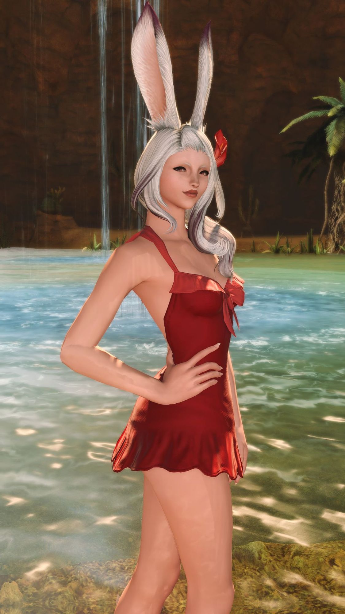 A Viera woman with silver hair and a red swimsuit, standing in front of a small pond with a waterfall cascading into it and surrounded by walls of stone.