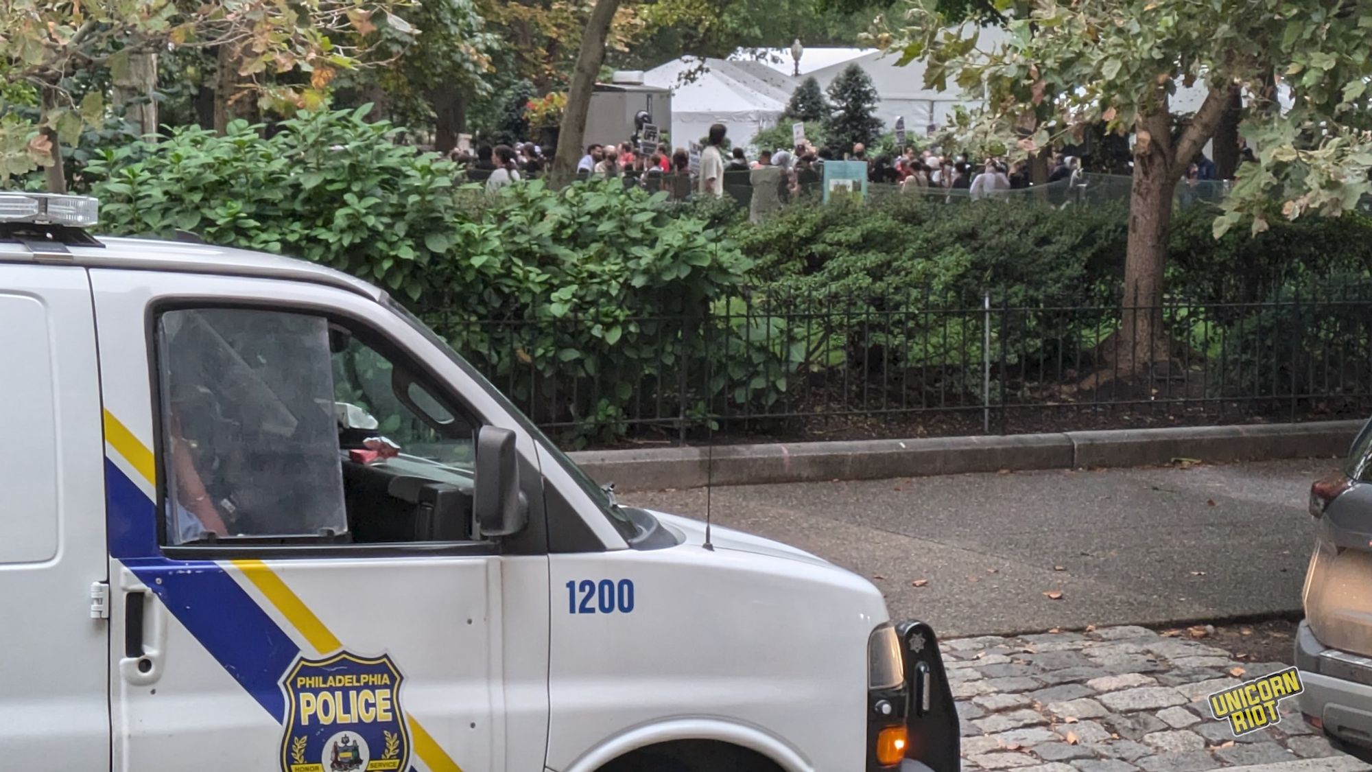 A Philadelphia Police van #1200 seen parked on the cobblestone street outside a line of bushes in Rittenhouse Square