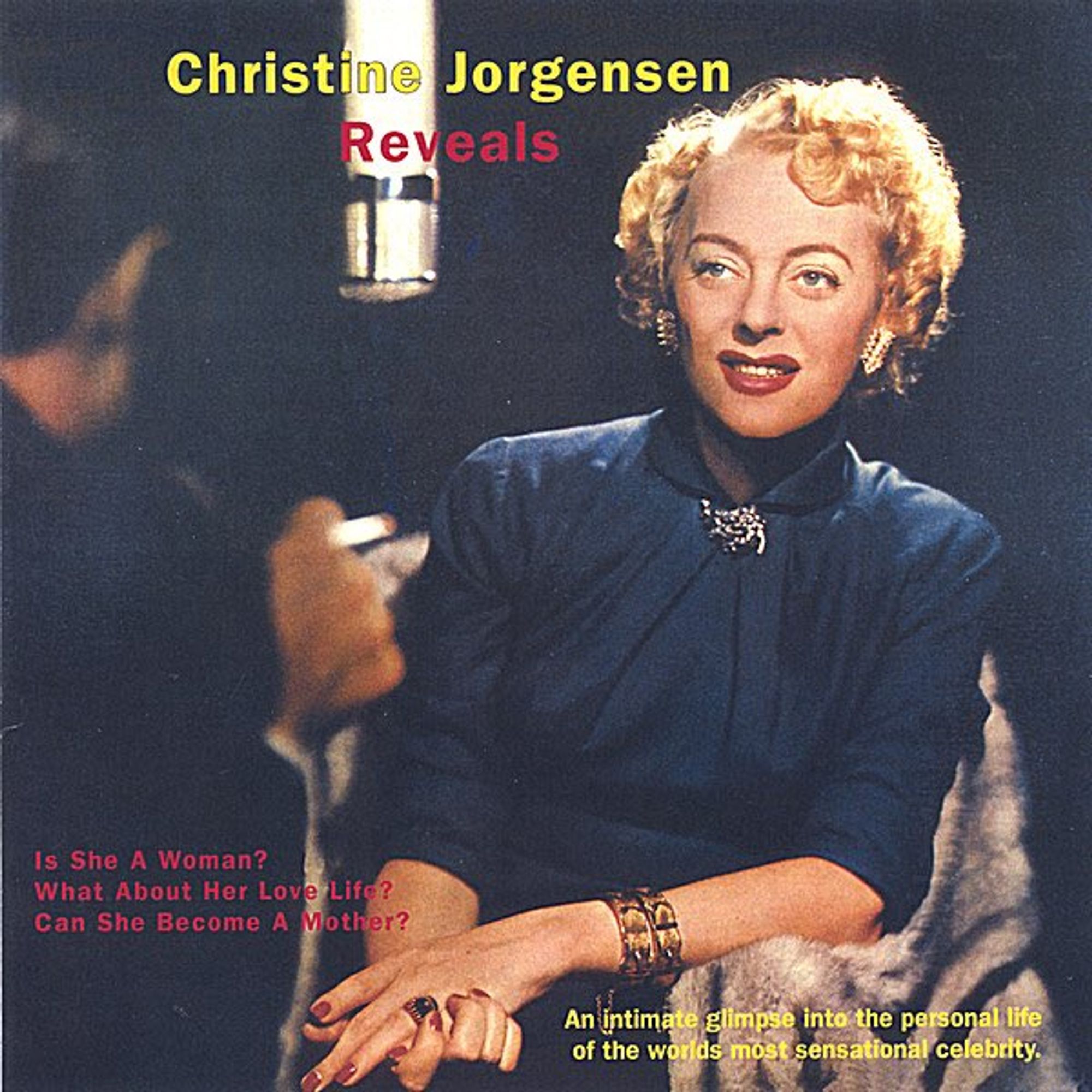 cover of an LP featuring a blonde woman in a blue blouse with jewelry and artful makeup. she is smiling and sitting opposite her interviewer, who is seen from behind and holding a cigarette. a microphone hangs in the air between them. words at the top read: Christine Jorgensen Reveals. toward the bottom left, words read: Is she a woman? what about love life? can she become a mother? and toward the bottom right: an intimate glimpse into the personal life of the world's most sensational celebrity.