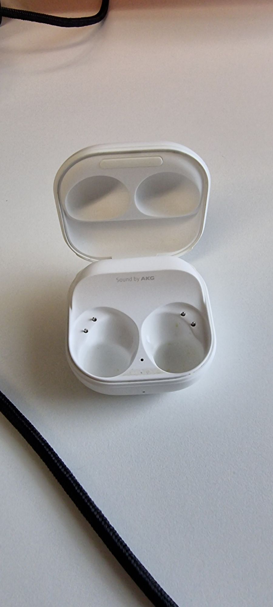 An empty earbuds case