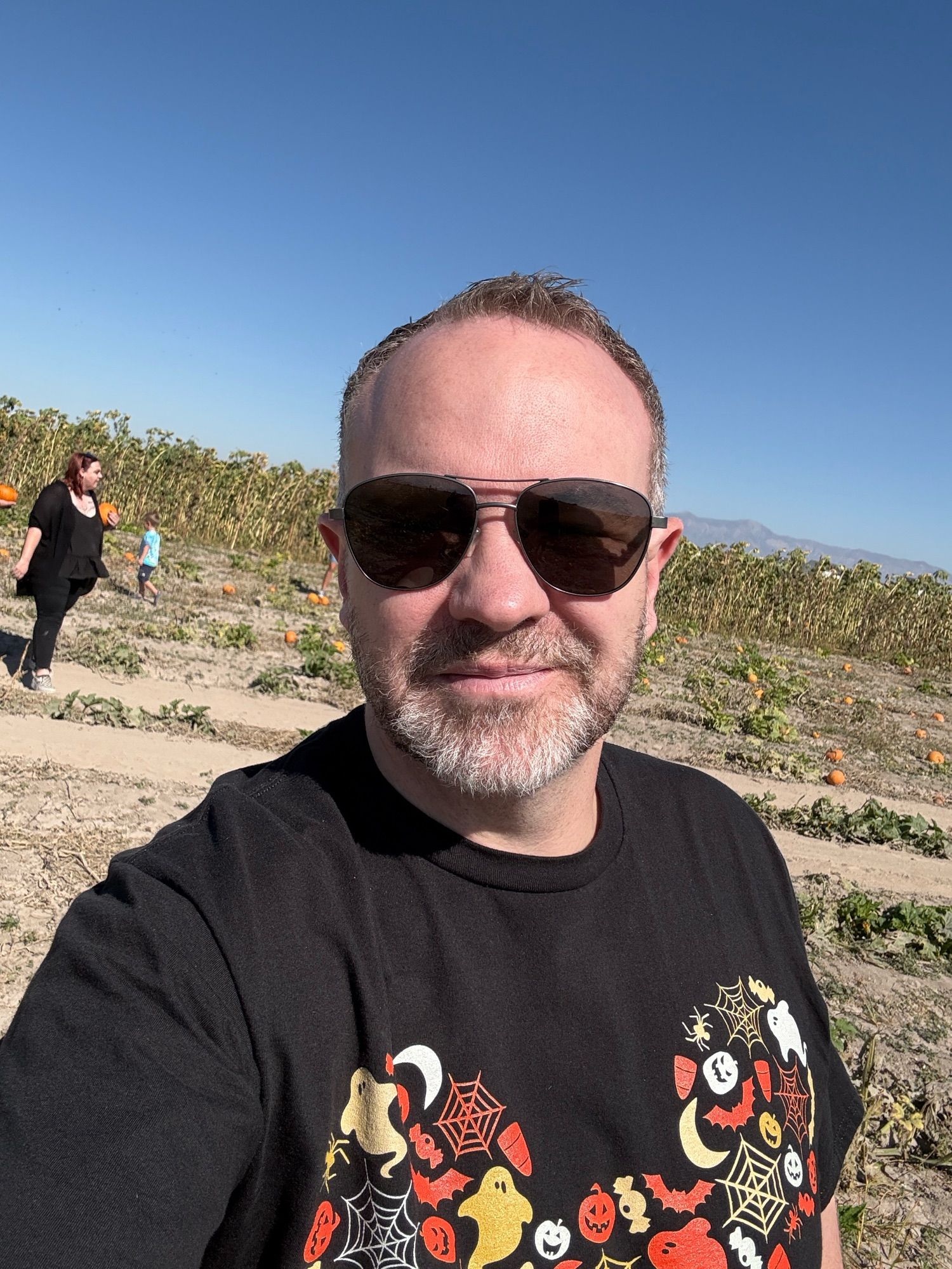 Me waiting to pick my pumpkin from the patch. Not pictured nieces and nephews.