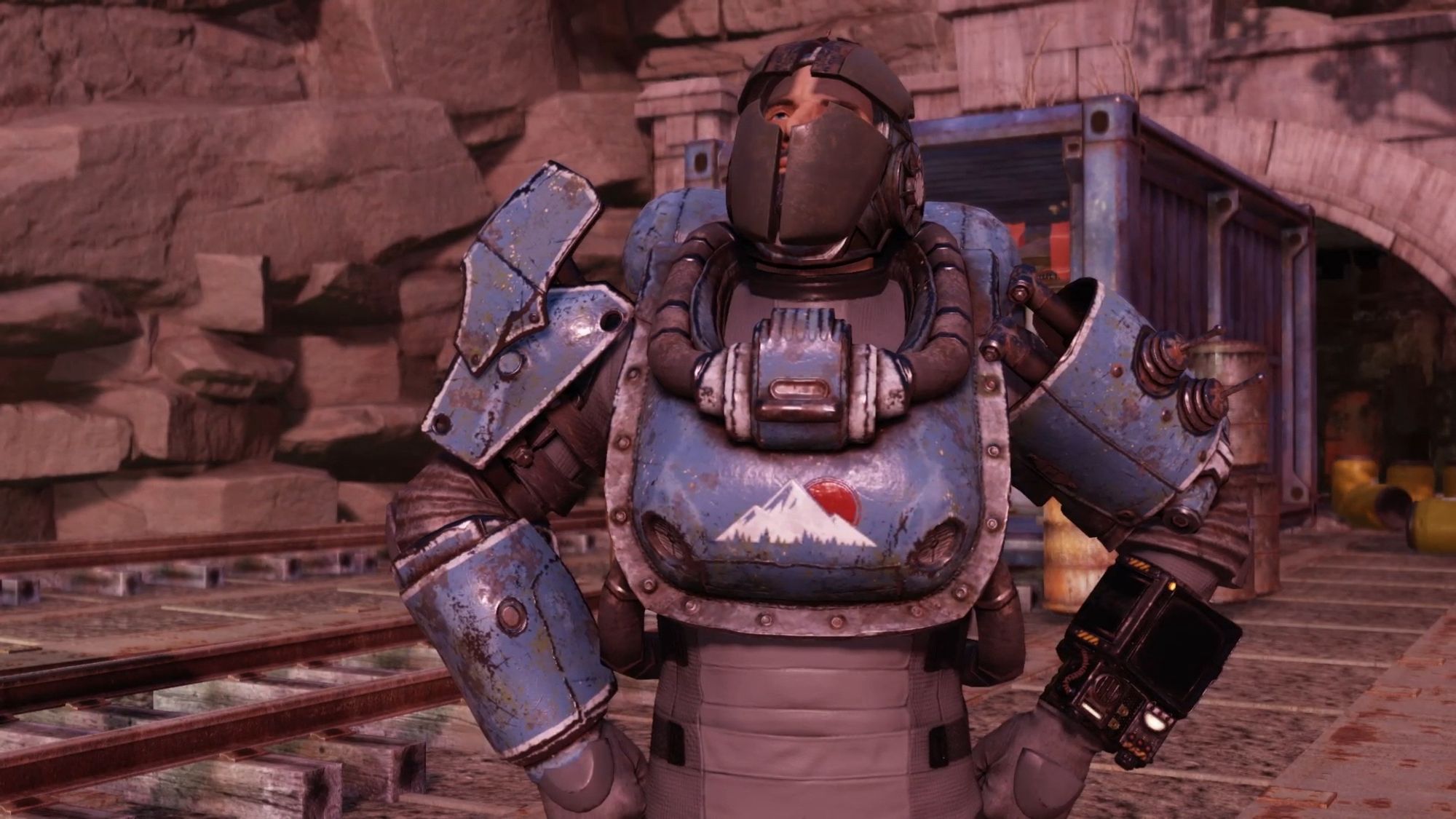 Screenshot from the game fallout 76 centring on the player character wearing a mismatched suit of armour made of metal and pipes.