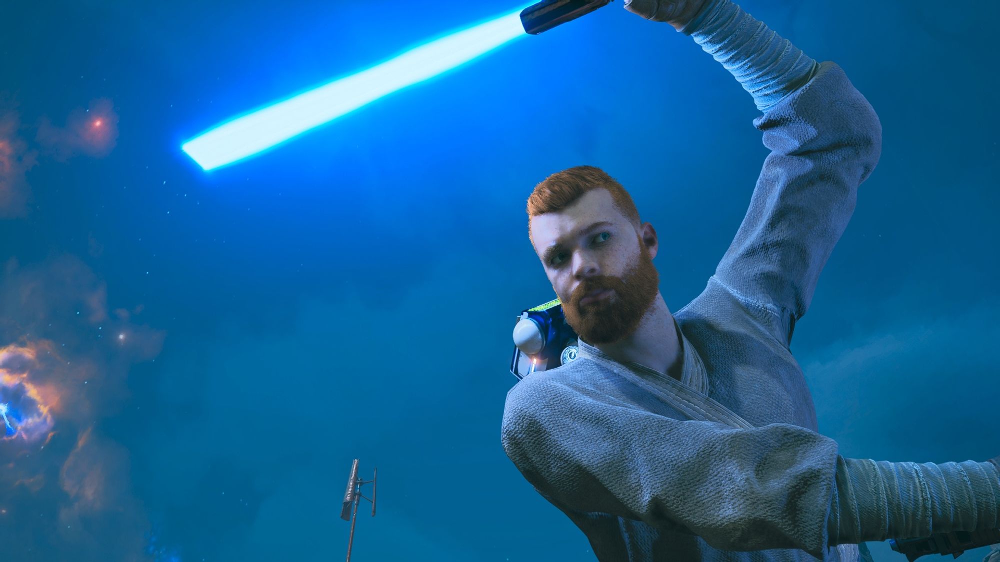 Screenshot from the game Star Wars Jedi Survivor, the primary character, Cal Kestis, appears in motion and swinging a lightsaber above his head.