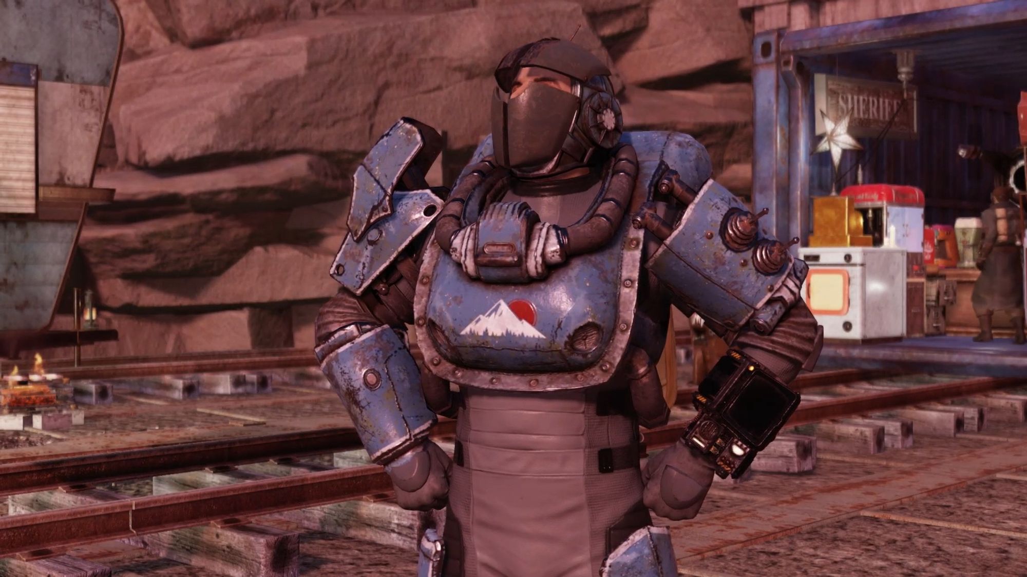 Screenshot from the game fallout 76 centring on the player character wearing a mismatched suit of armour made of metal and pipes.