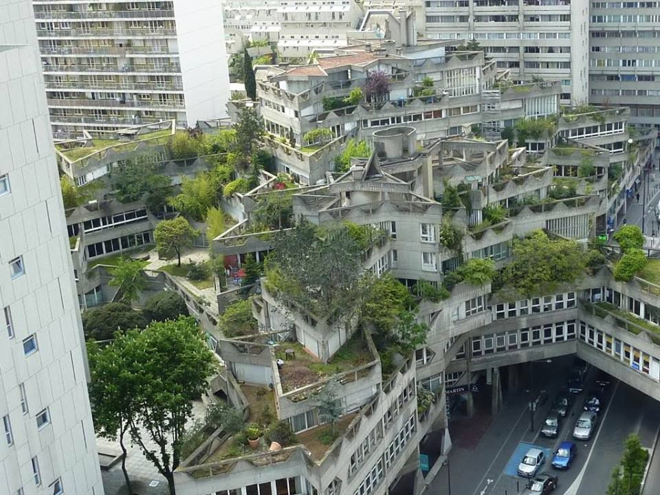 the same stock image that always gets used of an elaborate concrete building covered in trees and foliage