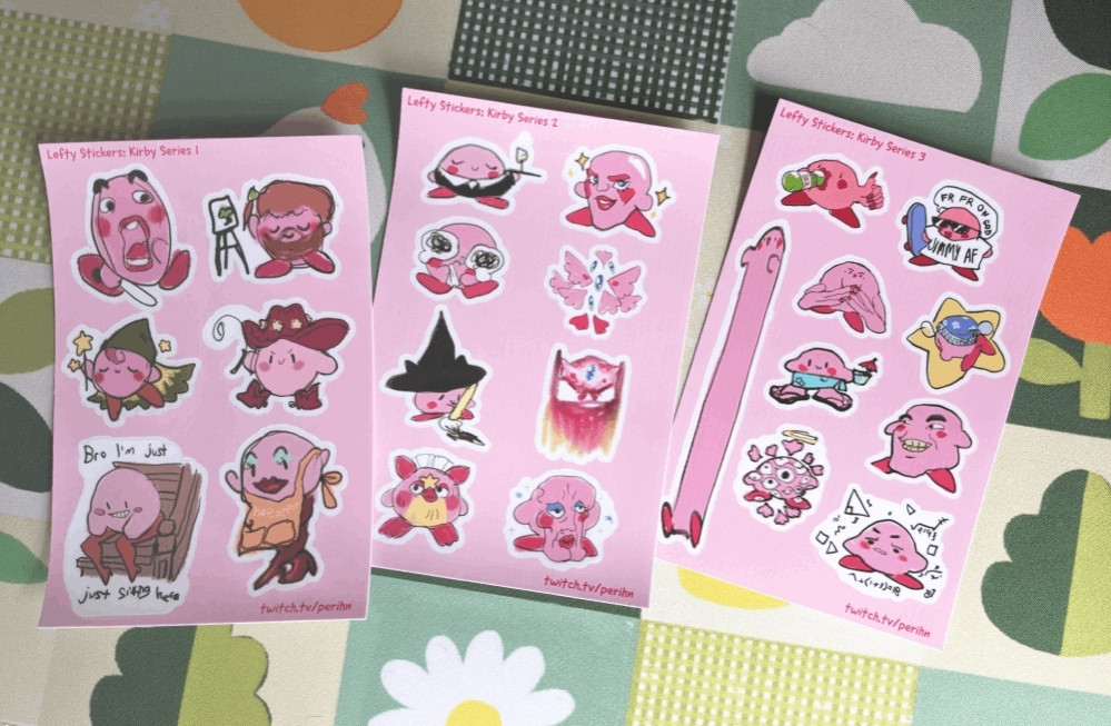 3 pink sticker sheets with an assortment of kirbies drawn with my left hand. (i am right handed, these were very hard to draw Imao)