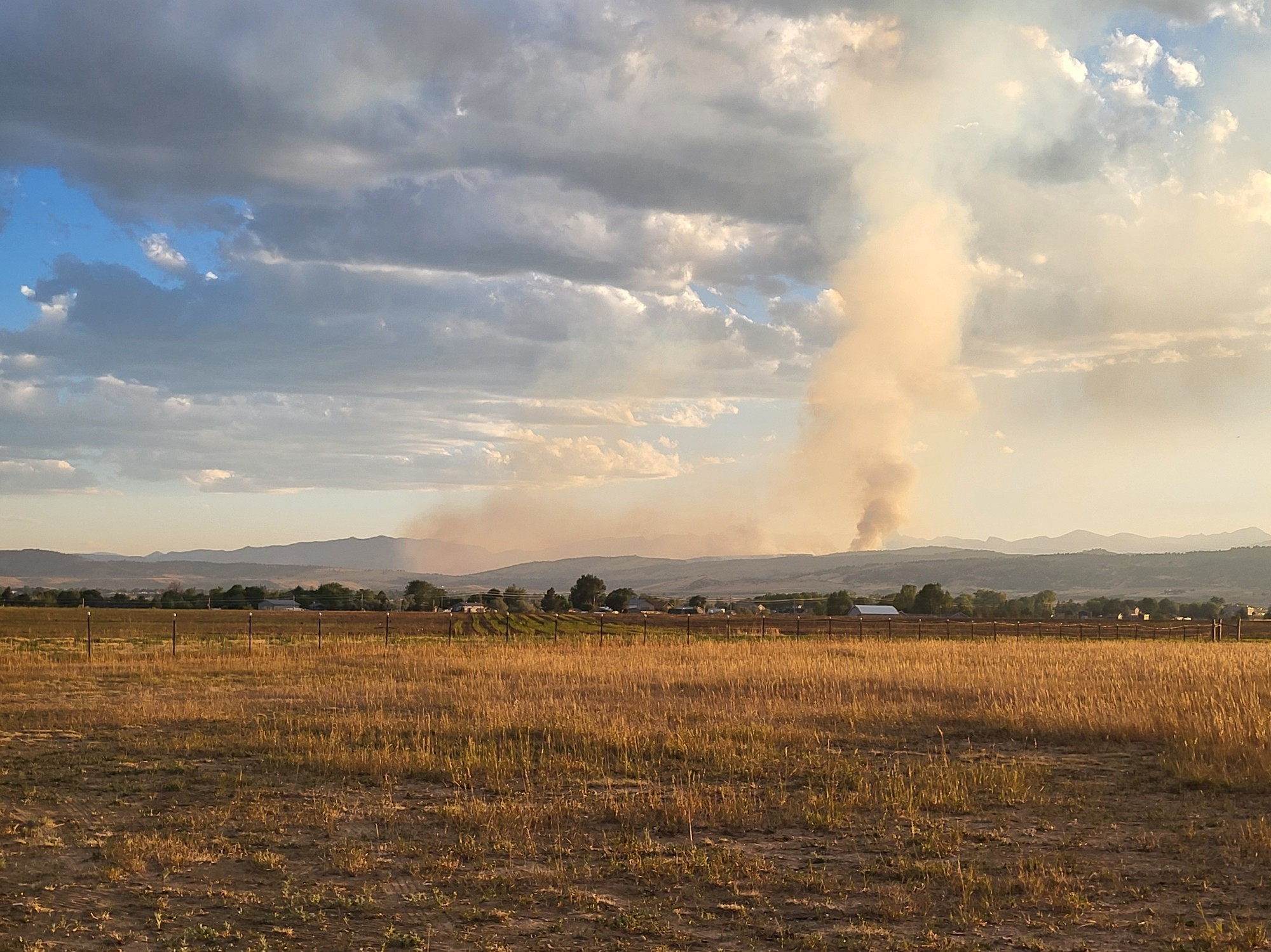 Smoke rising above mountains