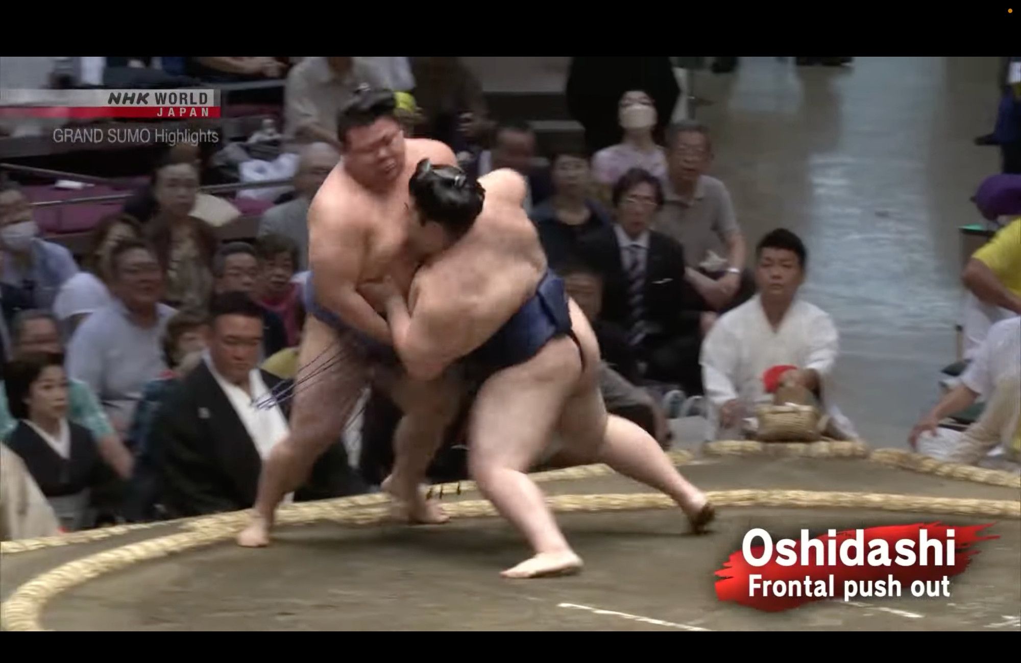 A sumo wrestler goes to the outside edge of his balance on one leg to   prevent his opponent from escaping to the side