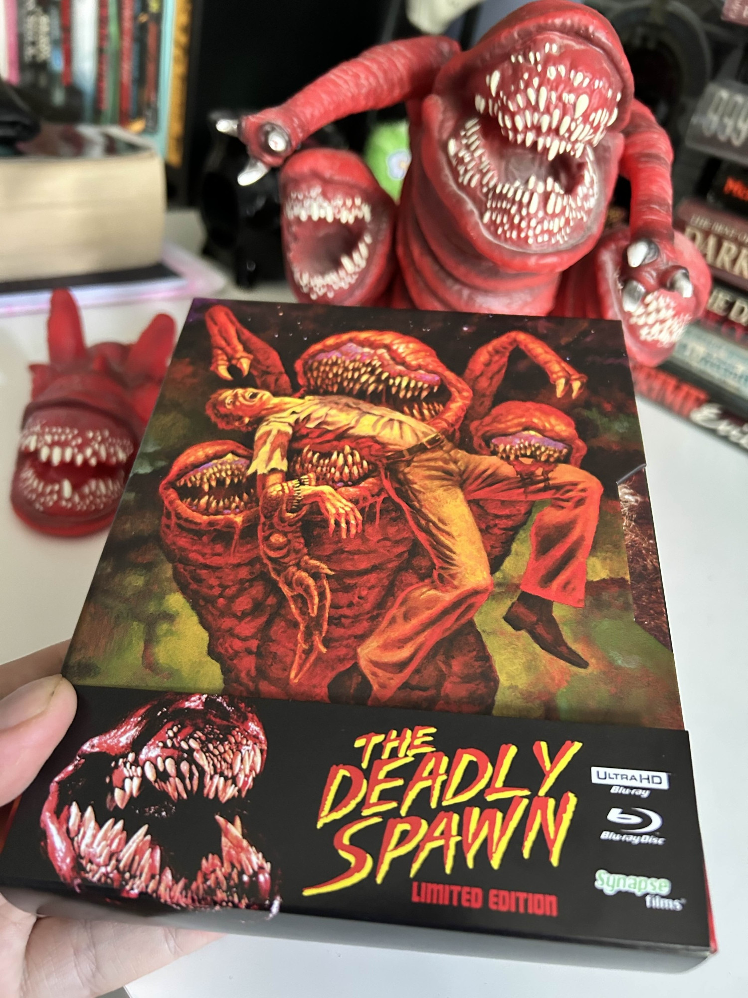 The Deadly Spawn on 4K UHD! a giant fleshy red toothy monster devours a man on the cover.