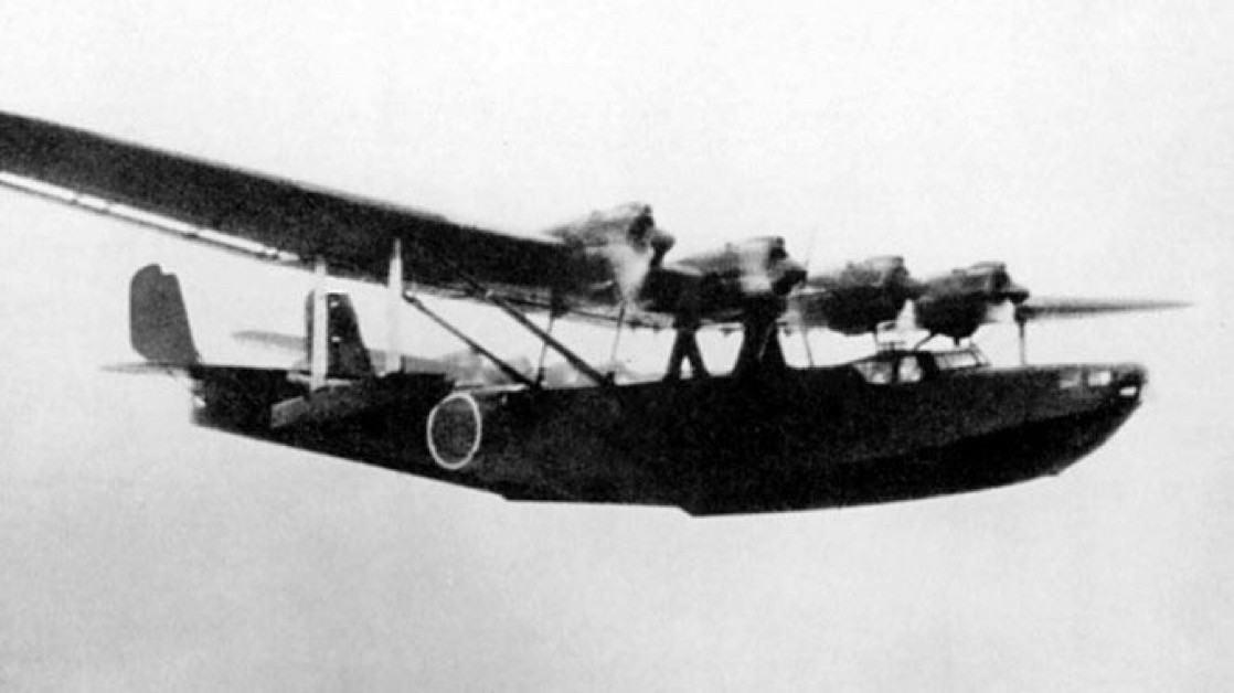 4 engined Japanese flying boat, its wing mounted above the fuselage on pylons.